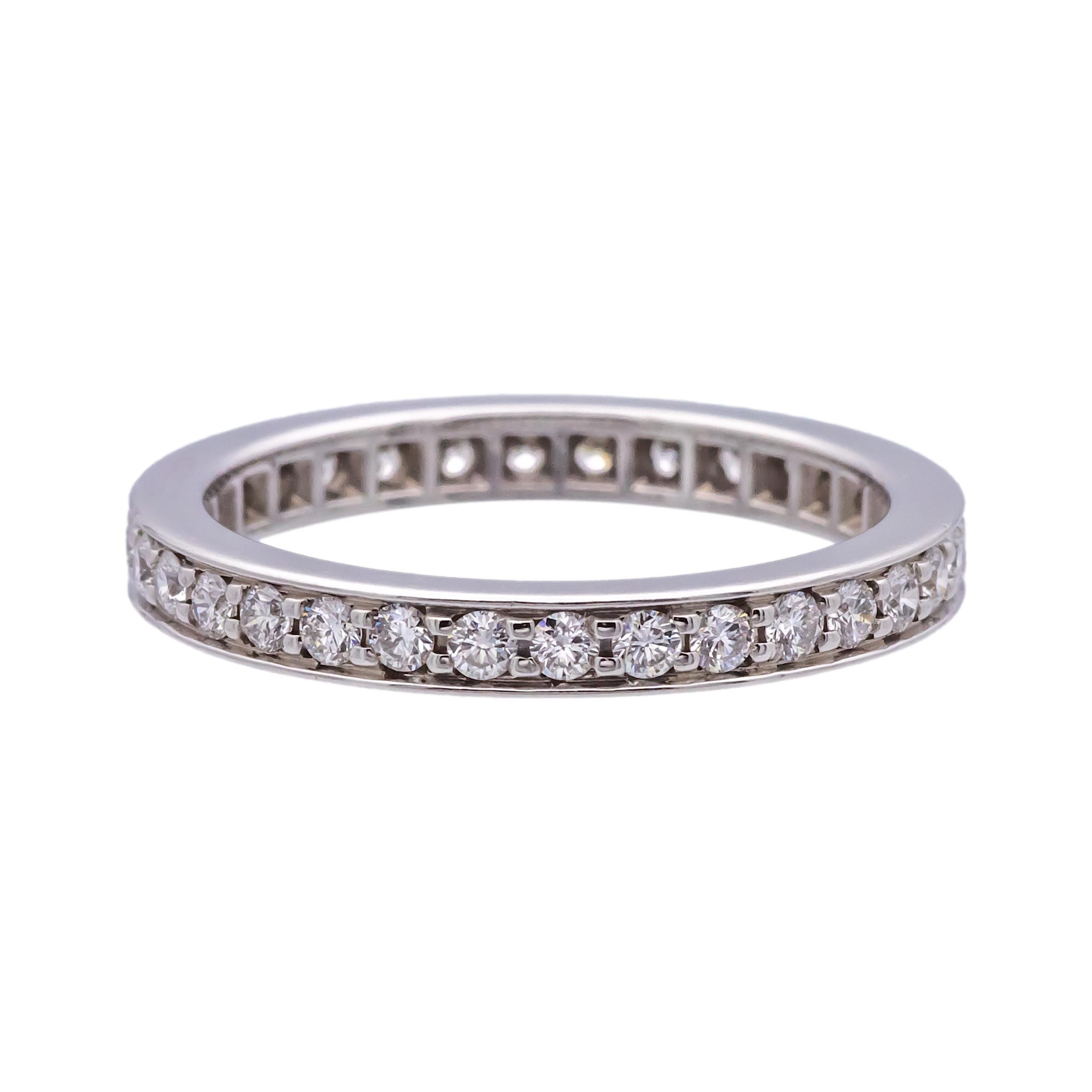 Cartier diamond band ring from the Ballerine collection finely crafted in platinum with channel set round brilliant cut diamonds weighing 0.40 cts total weight approximately set all the way around. Hallmarks are faded. Ring has only been lightly