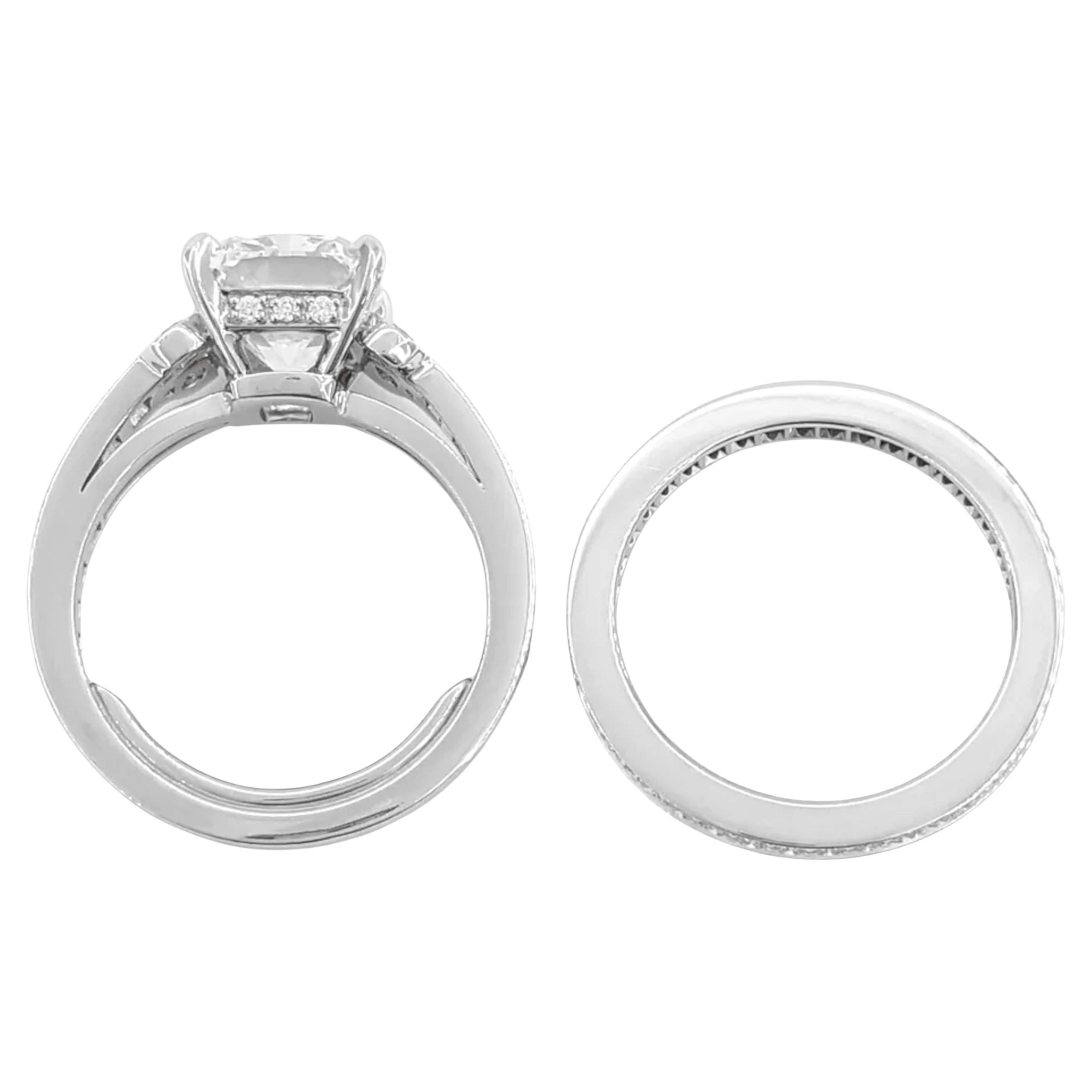Cartier Ballerine Solitaire Engagement Ring and Wedding Band Set, a perfect symbol of love and elegance. This stunning set features a brilliant 3.05 ct elongated cushion-cut diamond center stone, showcasing an F color and VS1 clarity with excellent