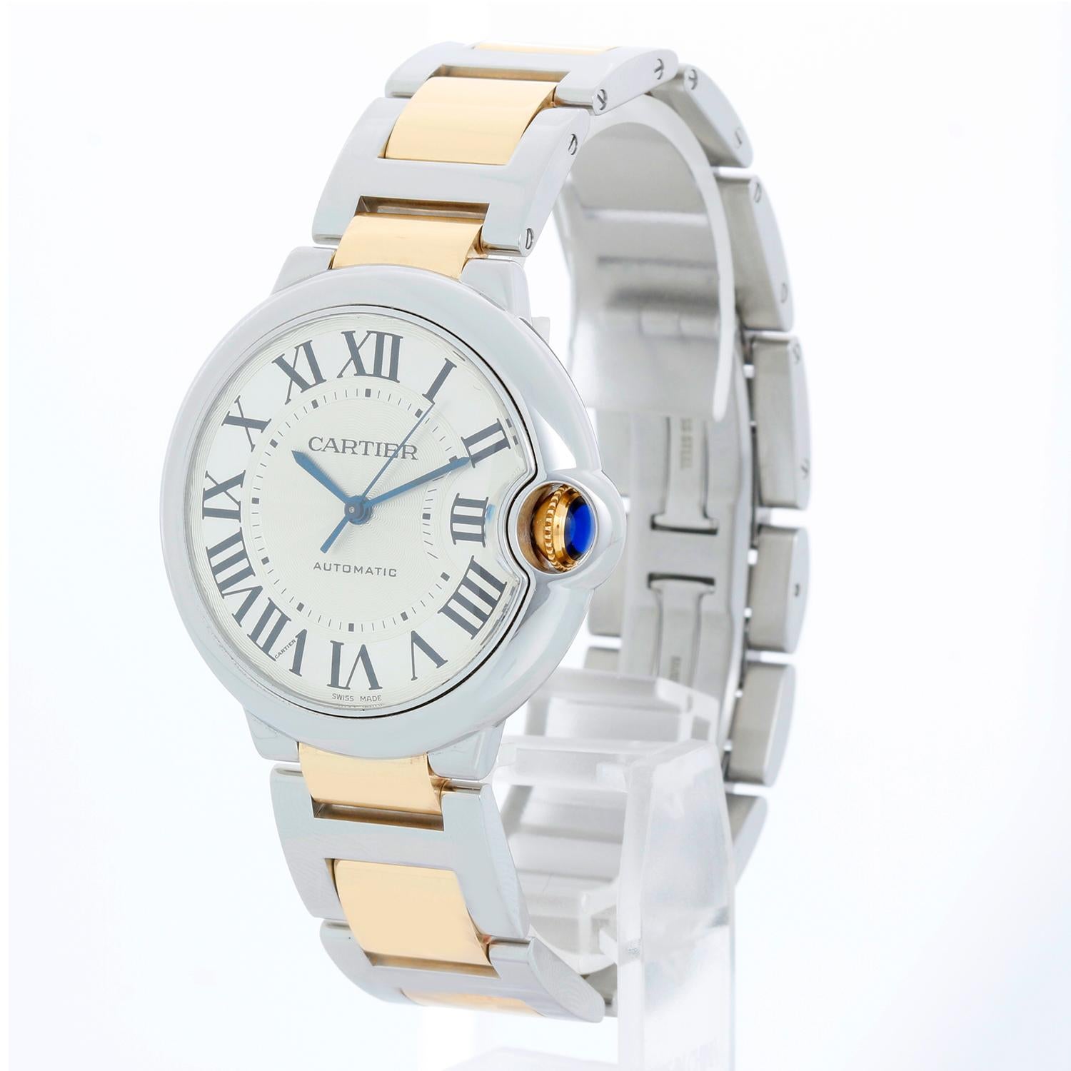 Cartier Ballon Bleu 2-Tone Midsize Men's/Ladies W6920047 Watch 3284 - Automatic winding. Stainless steel case (36mm diameter). Silver guilloche dial with black Roman numerals. Stainless steel and 18k yellow gold Cartier bracelet. Pre-owned with