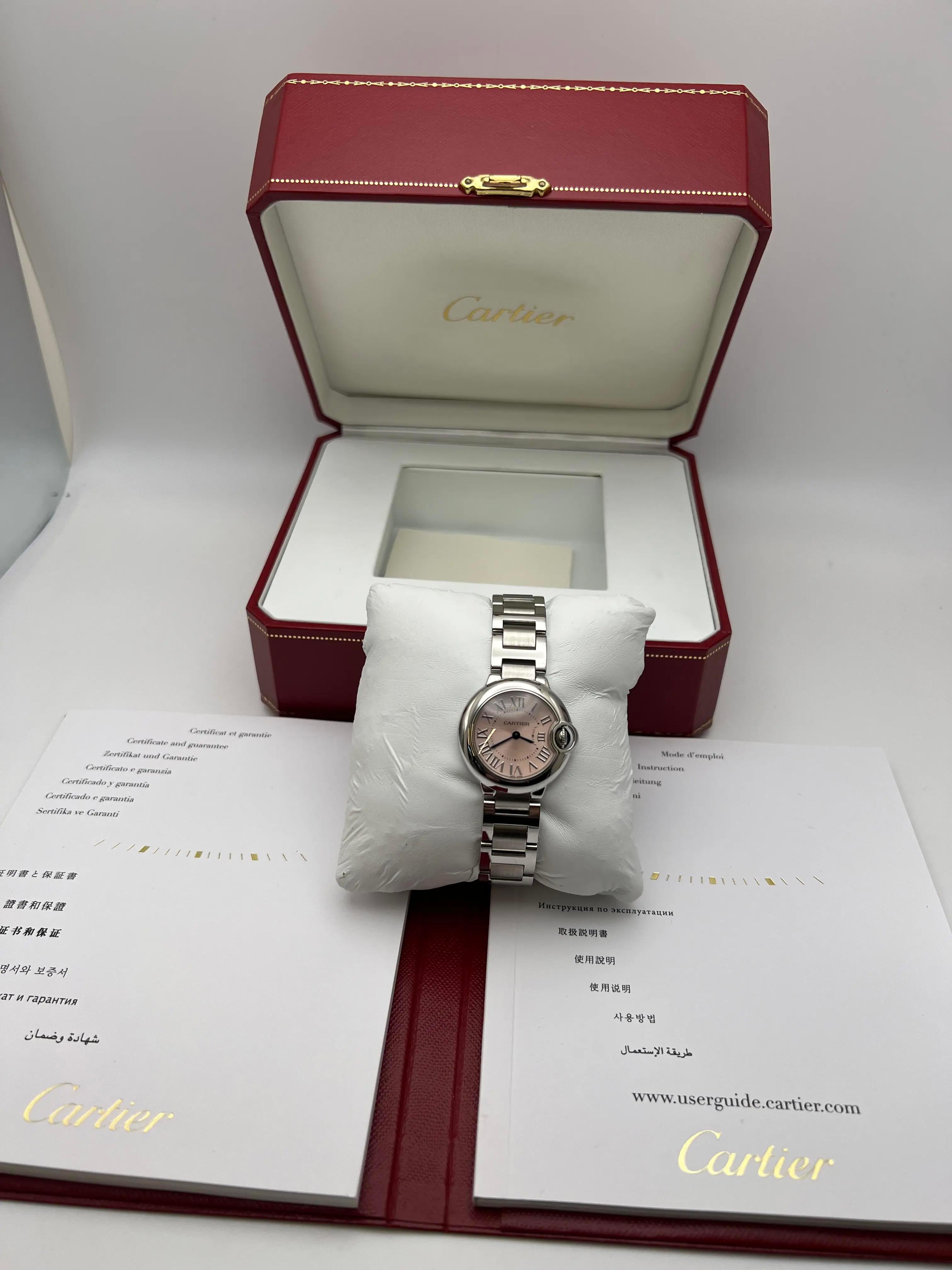 The Cartier Ballon Bleu 28mm (reference W6920038) is a refined timepiece that exemplifies Cartier's commitment to blending classic design with luxurious craftsmanship. Crafted from polished stainless steel, the 28mm round case is complemented by a
