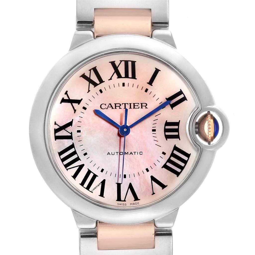 Cartier Ballon Bleu 36 Midsize Steel Rose Gold MOP Ladies Watch W6920070. Automatic self-winding movement. Caliber 076. Round stainless steel case 36 mm in diameter. Fluted 18K rose gold crown set with the blue spinel cabochon. Stainless steel fixed
