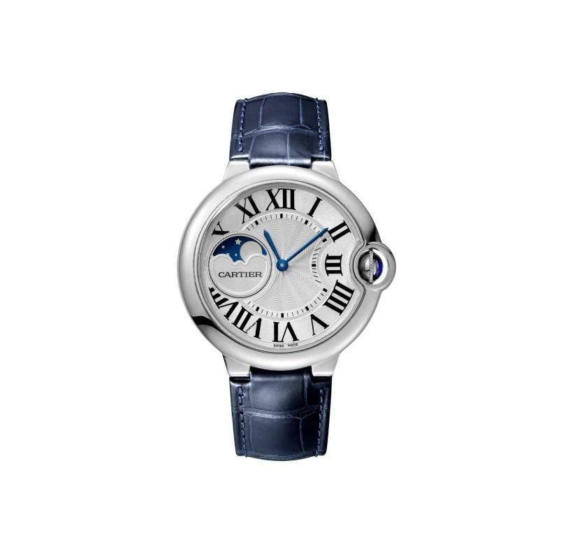 Ballon Bleu de Cartier watch, 37 mm. Mechanical movement with automatic winding, moon phases. Steel case, fluted crown set with a cabochon synthetic spinel. Silver guilloché dial. Moon phases at 9 o’clock. Blued-steel sword-shaped hands. Sapphire