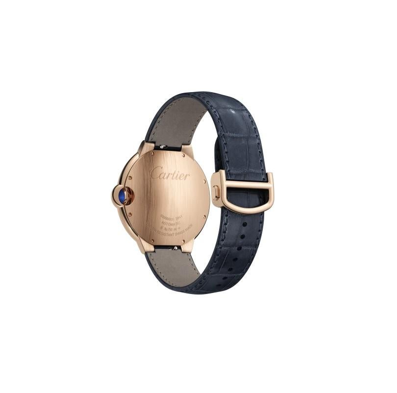 Ballon Bleu de Cartier watch, 42 mm. Mechanical movement with automatic winding, caliber 1847 MC. 18K pink gold case, fluted crown set with a cabochon sapphire, blue guilloché dial. Sword-shaped hands. Sapphire crystal. Navy blue alligator leather