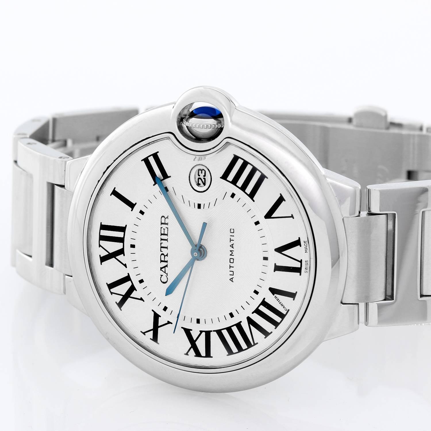 Cartier Ballon Bleu Men's 42mm Stainless Steel Automatic Watch W69012Z4 -  Automatic winding. Stainless steel case (42mm diameter). Silvered guilloche dial with black Roman numerals; date at 3 o'clock. Stainless steel Cartier bracelet with deployant