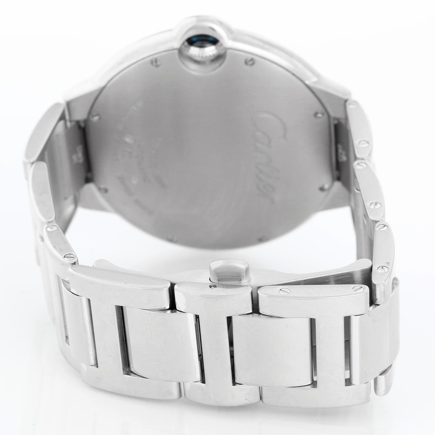 Cartier Ballon Bleu Men's 42mm White Gold Automatic Watch W69013Z2 - Automatic winding. White gold (42mm diameter). Silver guilloche dial with black Roman numerals; date at 3 o'clock. White gold Cartier bracelet with deployant clasp. Pre-owned with