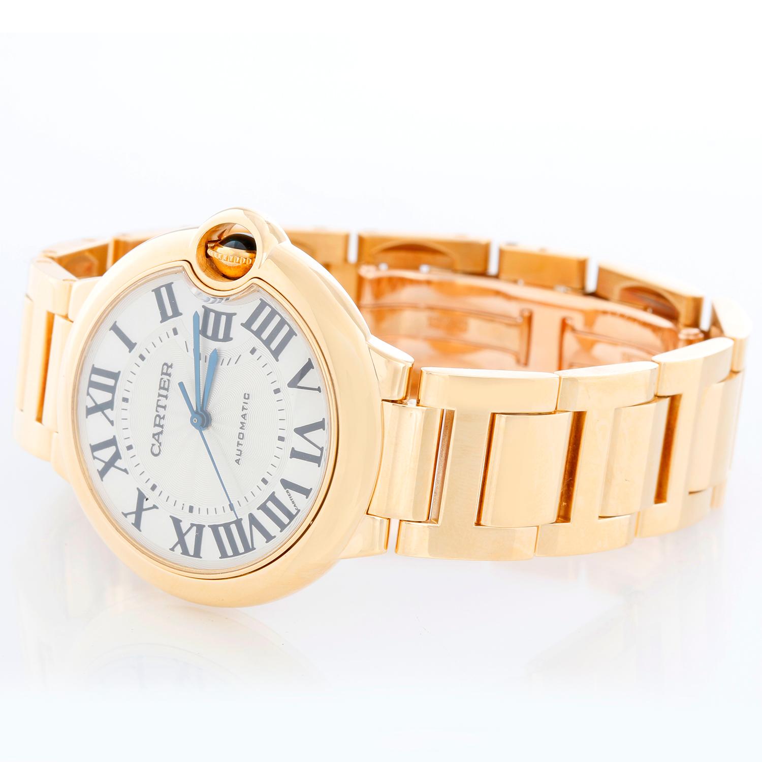 Cartier Ballon Bleu Midsize 18k Yellow Gold Watch WE902027 - Automatic winding. 18k yellow gold case (36 mm). Silver guilloche dial . 18k yellow gold Cartier bracelet with deployant clasp. Pre-owned with Cartier box .
