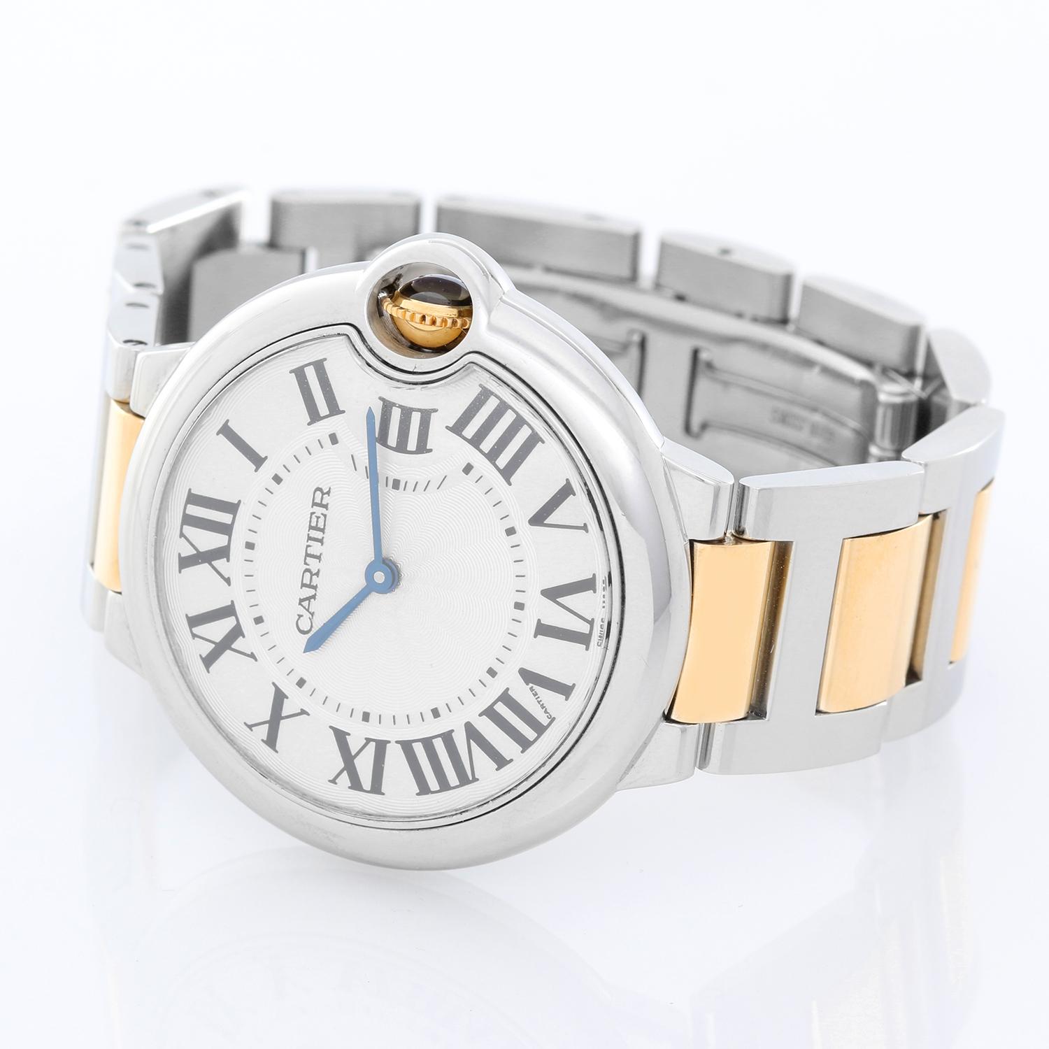 Cartier Ballon Bleu Midsize Stainless Steel Mens/Ladies Watch W69011Z4 - Quartz. Stainless steel case (36mm diameter). Silver guilloche dial with black Roman numerals. Stainless steel Cartier bracelet with deployant clasp. Pre-owned with  Cartier