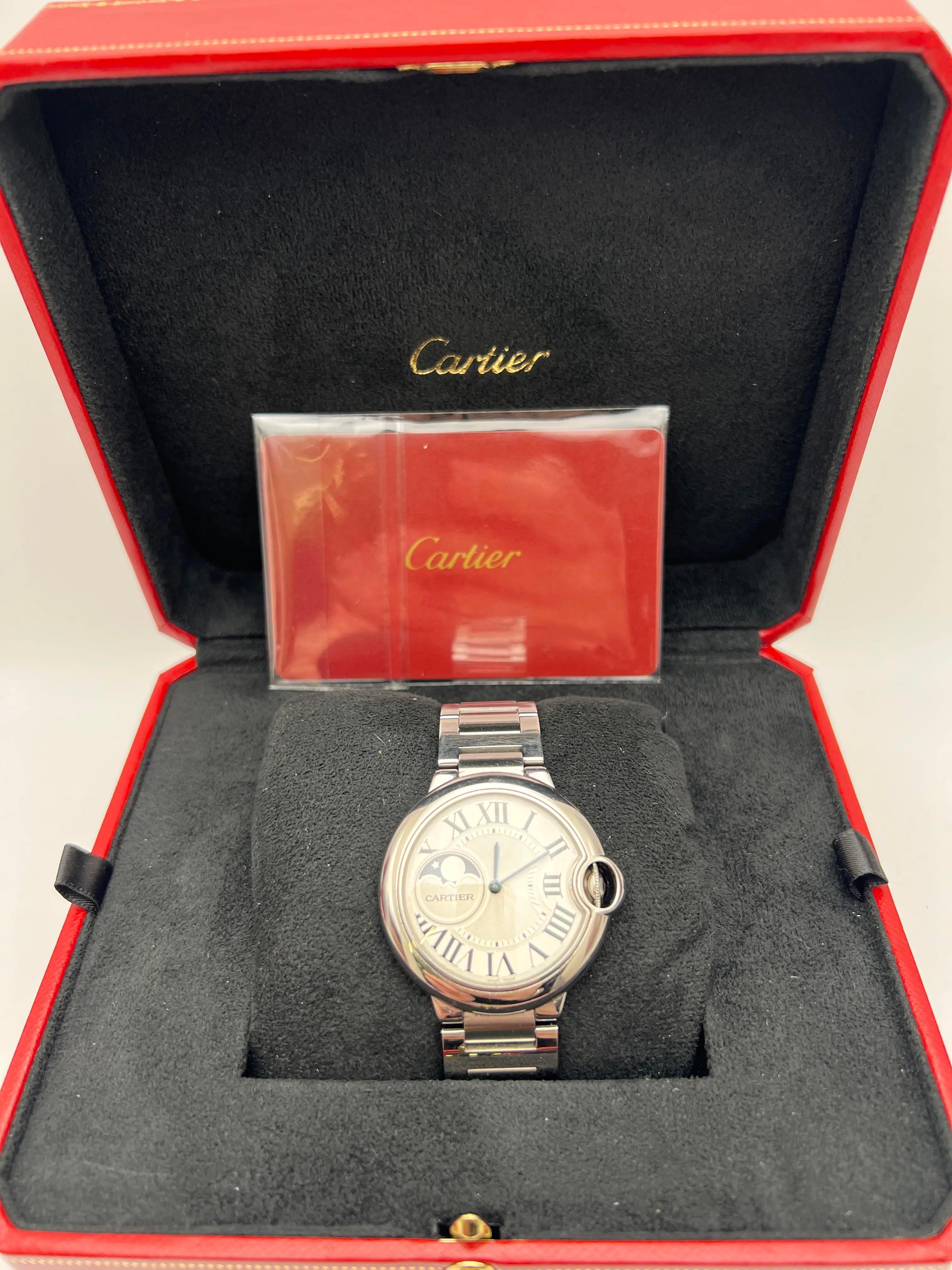 iturn0image0The Cartier Ballon Bleu Moonphase 37mm (reference WSBB0021) is a refined timepiece that exemplifies Cartier's commitment to blending classic design with sophisticated craftsmanship. Crafted from stainless steel, the 37mm round case