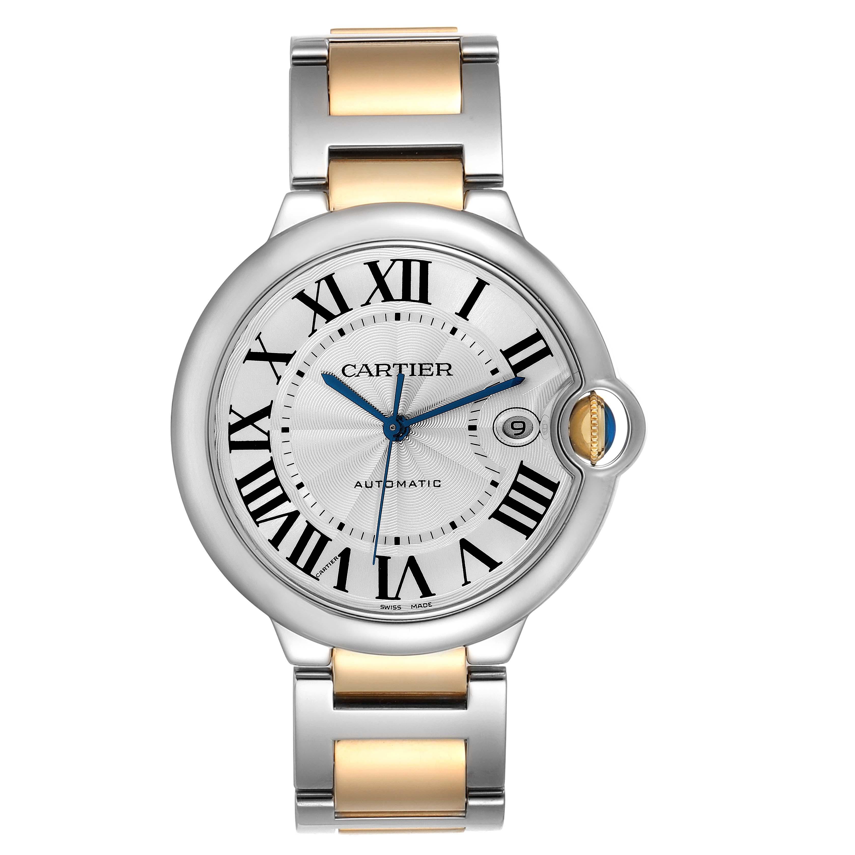 Cartier Ballon Bleu Silver Dial Steel Yellow Gold Mens Watch W69009Z3. Automatic self-winding movement. Caliber 049. Round stainless steel case 42.1 mm in diameter, 13 mm thick. Fluted 18k yellow gold crown set with the blue spinel cabochon.