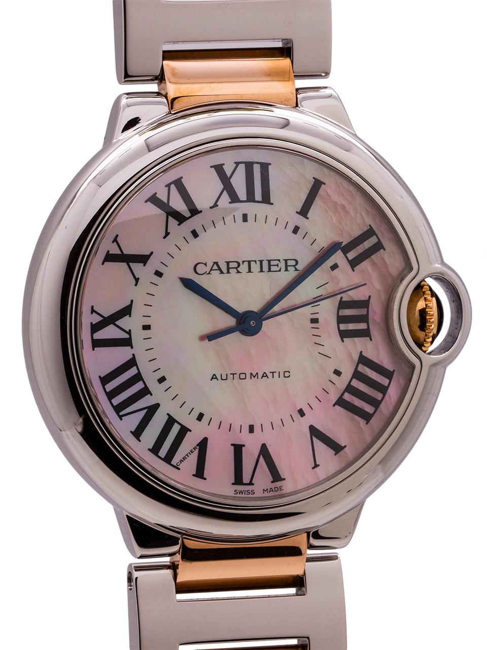
Cartier stainless steel and pink gold 36mm diameter Ballon Blue circa 2000’s. Featuring pink mother of pearl (MOP) guilloche dial with large printed black Roman numerals and blue steeled hands. Powered by self winding Cartier movement with sweep