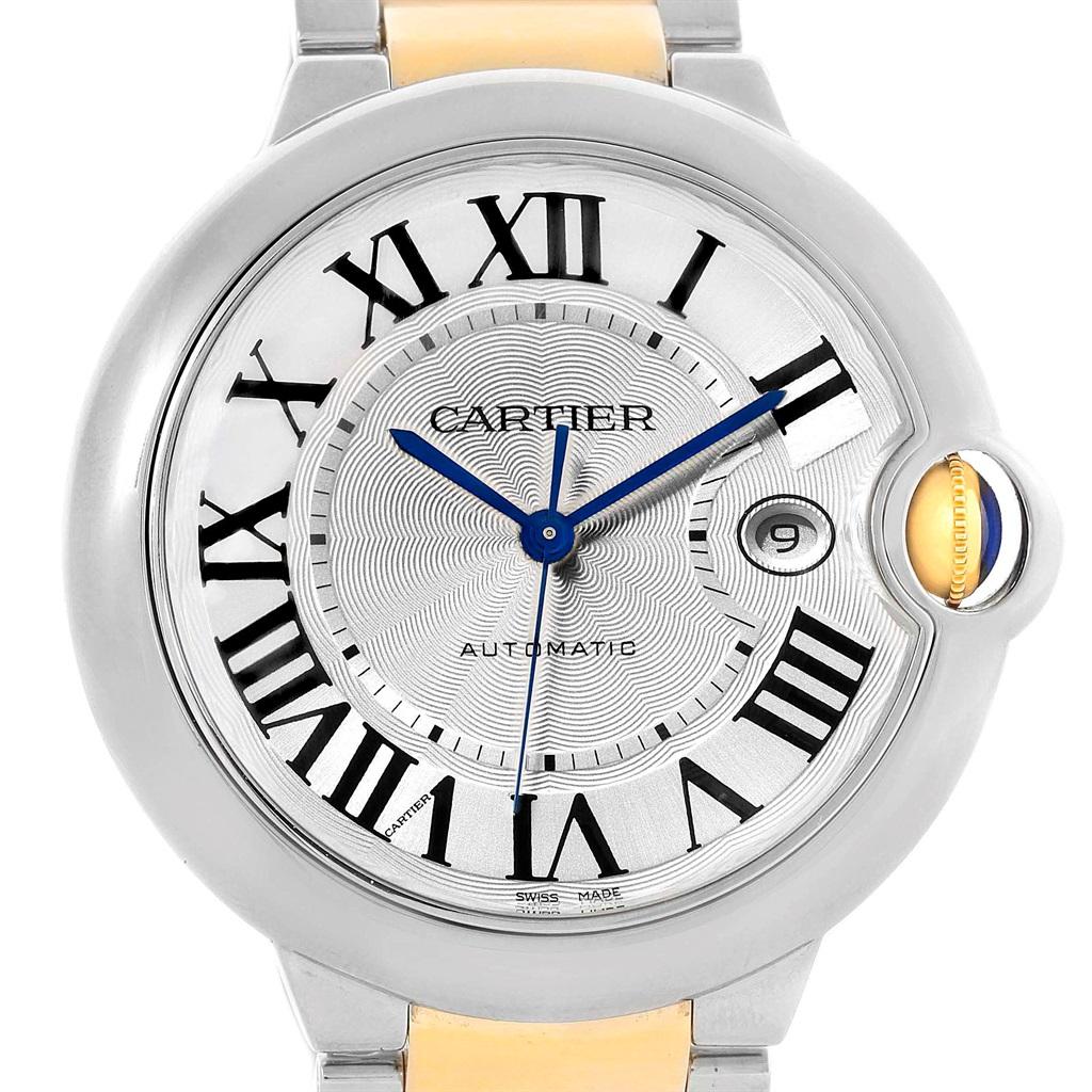 Cartier Ballon Bleu Steel Yellow Gold Mens Watch W69009Z3 Box Papers. Automatic self-winding movement. Round stainless steel case 42.1 mm in diameter, 13 mm thick. Fluted 18k crown set with the blue spinel cabochon. Fixed stainless steel smooth