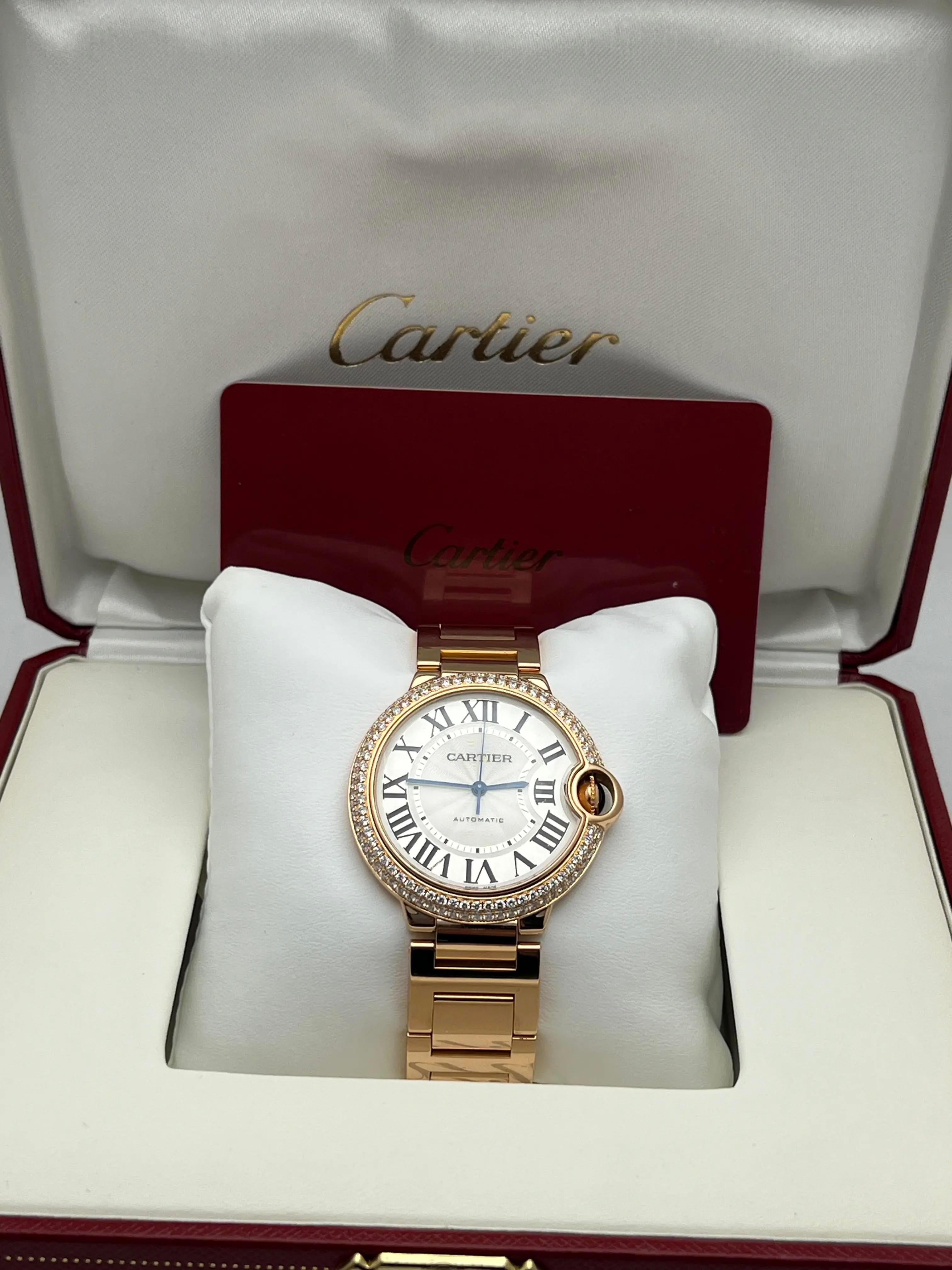​The Cartier Ballon Bleu 36mm (reference W69004Z2) is a refined timepiece that exemplifies Cartier's commitment to blending classic design with modern elegance. Crafted from 18K rose gold, the 36mm round case is adorned with a custom-set diamond