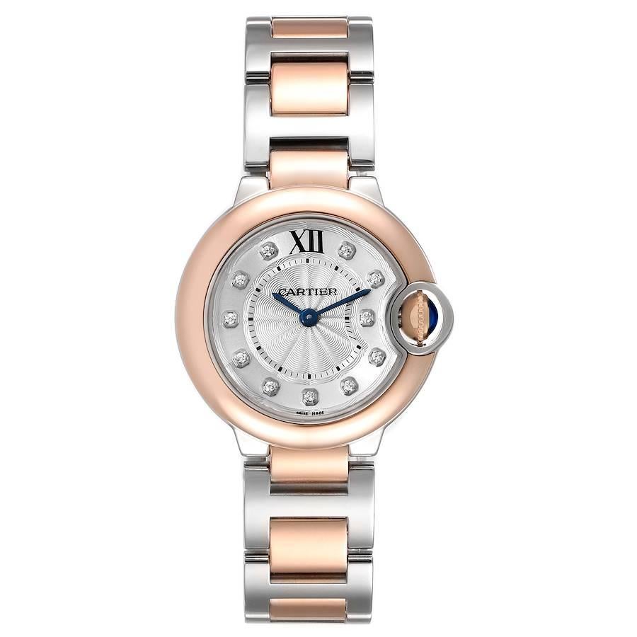 Cartier Ballon Blue 28 Steel Rose Gold Diamond Watch W3BB0005 Box Papers. Quartz movement. Caliber 057. Round stainless steel and 18K rose gold case 28.0 mm in diameter. Case thickness: 9.35 mm. Fluted crown set with the blue sapphire cabochon. 18K