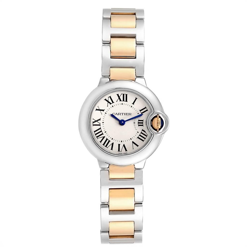 Cartier Ballon Blue 28 Steel Yellow Gold Small Ladies Watch W69007Z3. Quartz movement. Caliber 049. Round stainless steel case 29.0 mm in diameter. Fluted 18k crown set with the blue spinel cabochon. Stainless steel smooth bezel. Scratch resistant