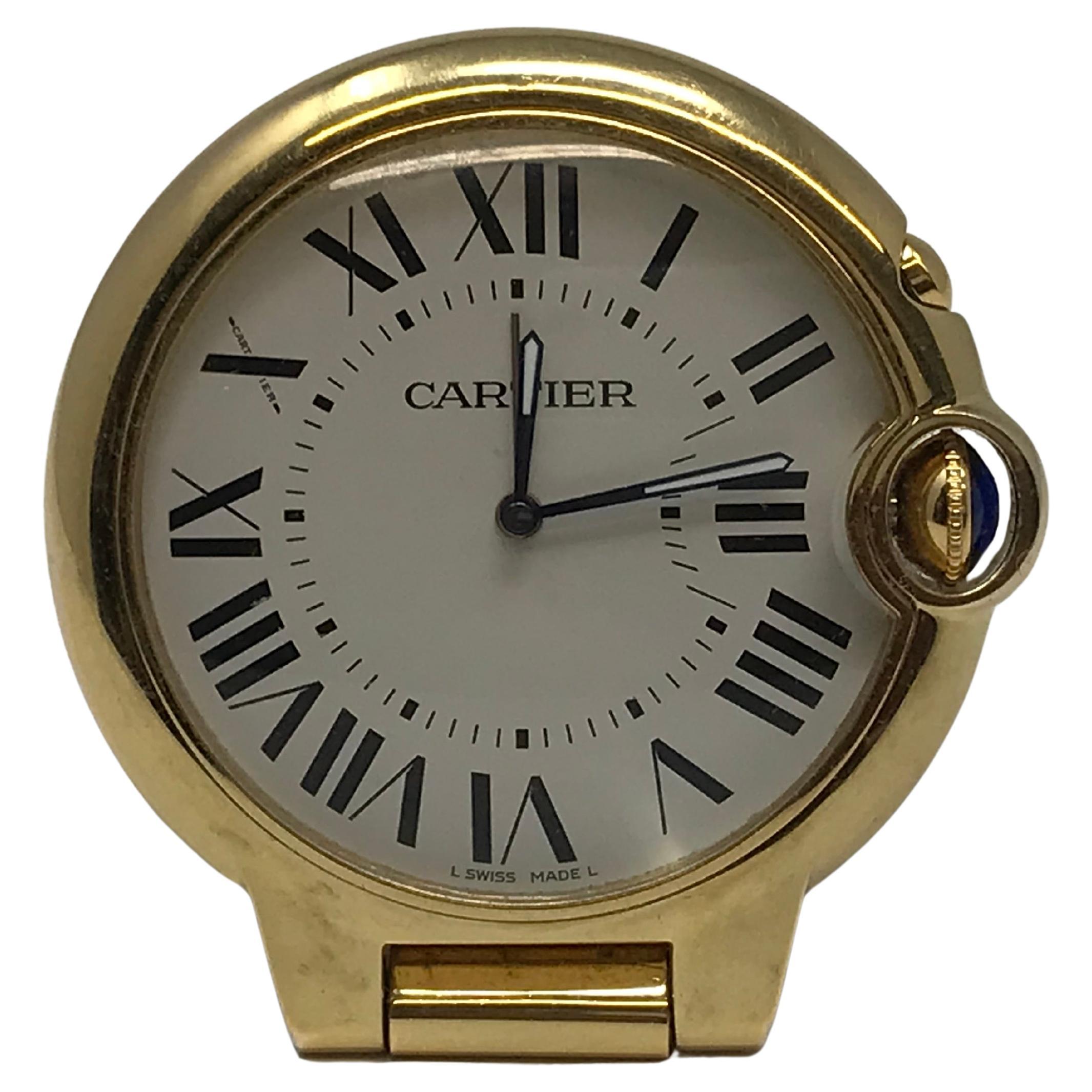 Cartier Ballon Blue Desk Clock, Gold tone with Alarm ref 3038, case number 667147GD , quartz operating, Roman Number ,case and Dial signed, Swiss made, circa 2010, in working order with sign of cosmetic wear due to use, No box.