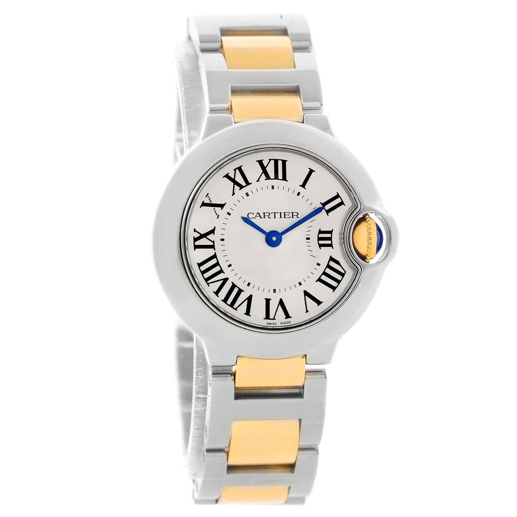 Cartier Ballon Blue Steel Yellow Gold Small Ladies Watch W69007Z3. Quartz movement. Caliber 049. Round stainless steel case 29.0 mm in diameter. Fluted 18k crown set with the blue spinel cabochon. Fixed stainless steel smooth bezel. Scratch