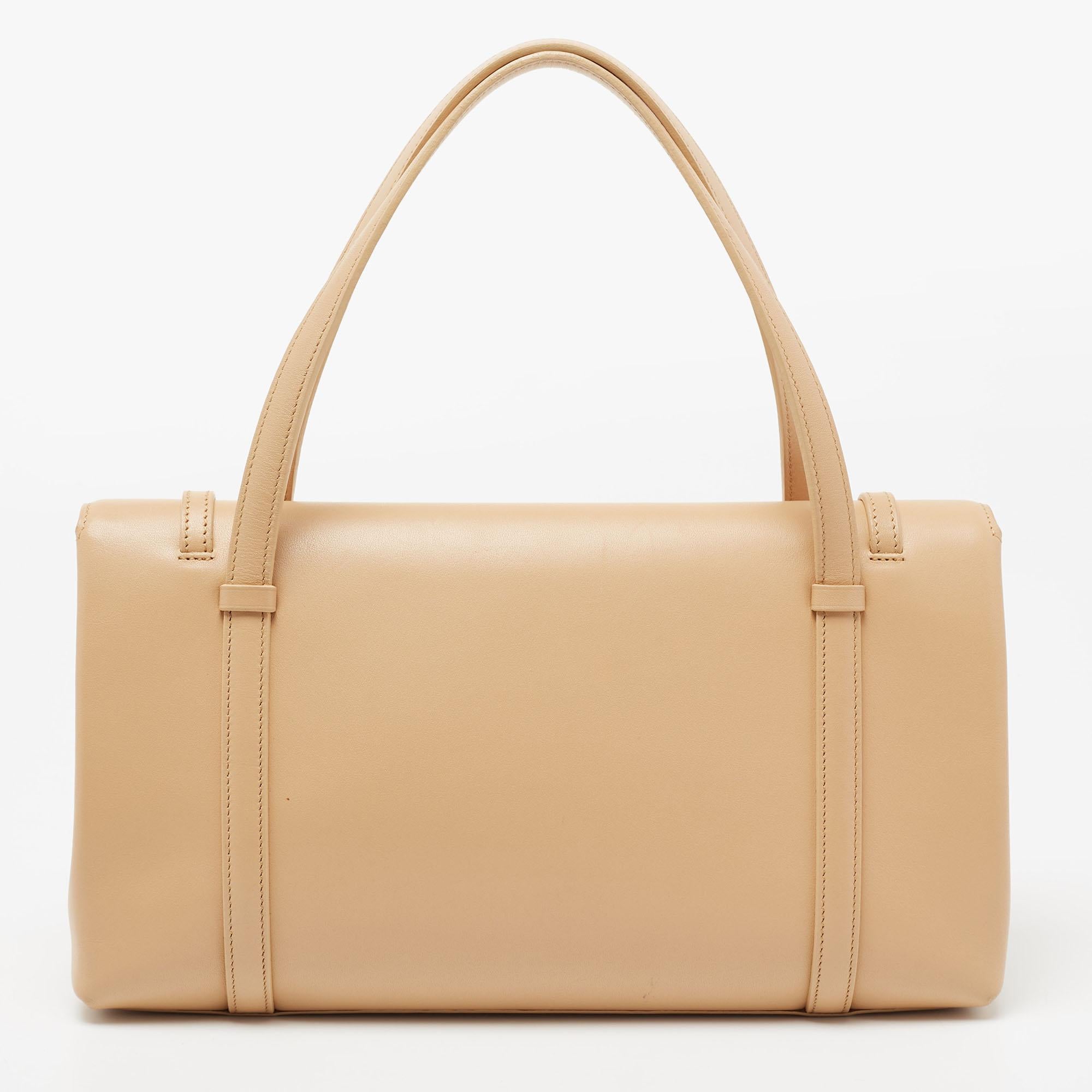 This Cartier bag is a timeless piece that can last you season after season. This bag is made of leather and sized to house all the things you need. It has a beige shade, logo detailing, two handles, and leather lining.

Includes: Original Dustbag,