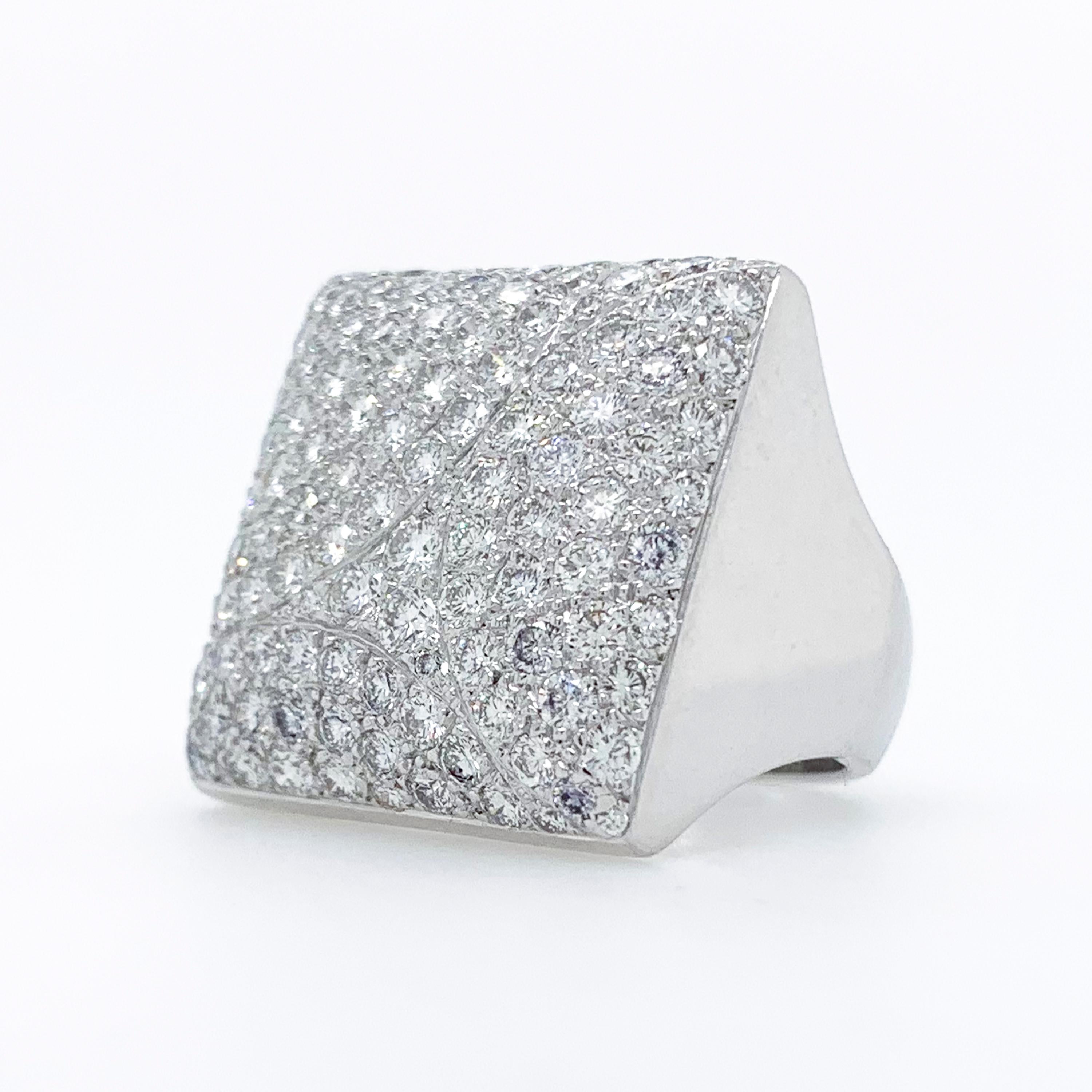 Cartier Berlingot pave diamond dome ring in 18k white gold. 

This ring features 117 pave set round brilliant cut diamonds totaling approximately 3.00 carats with E-F color and VS clarity.  The square top of this ring measures approximately 20mm x