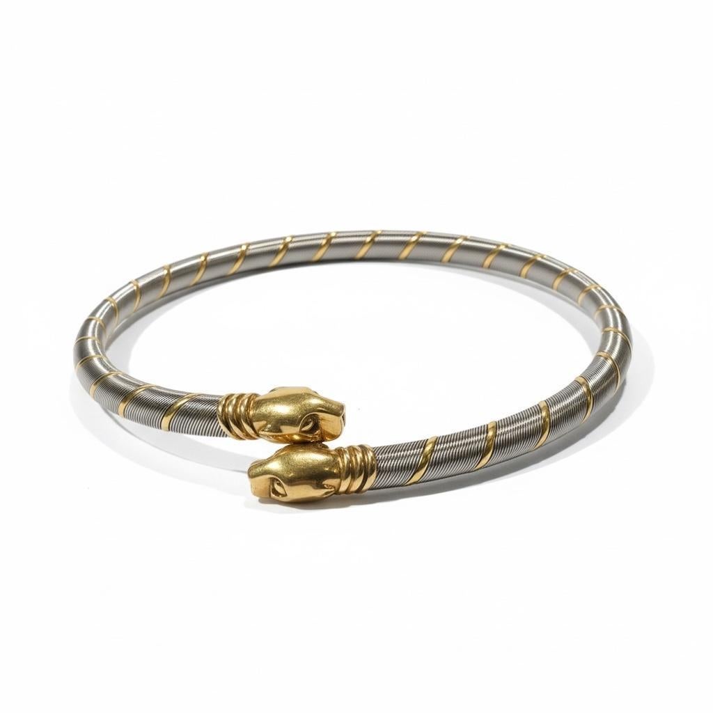 Two panthers, one unbroken line.

A signature of quiet force and sculptural restraint, this Cartier necklace captures the Maison’s enduring icon—the panther—in a refined industrial form. Crafted in a taut collar of stainless steel, the piece is