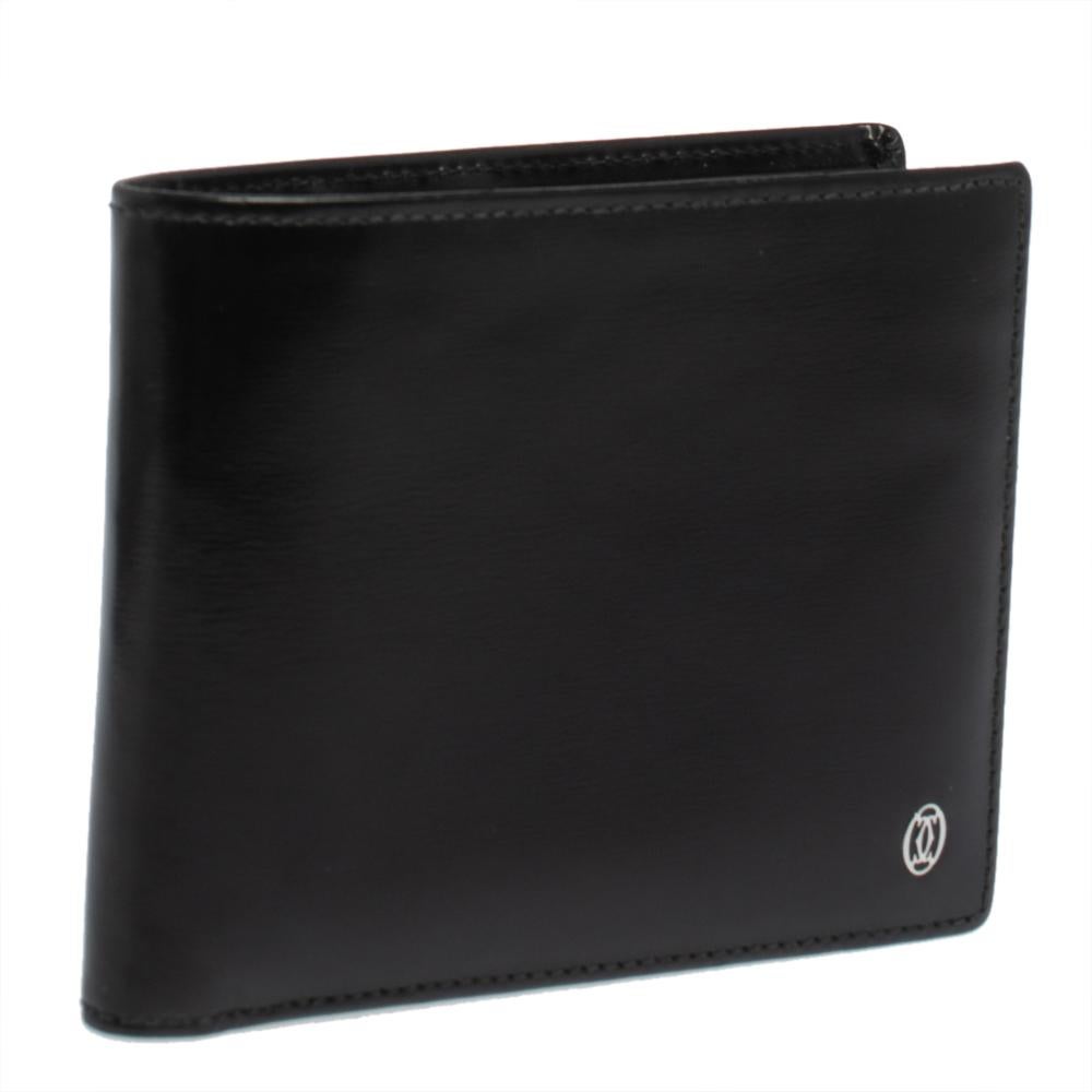 This Must De Cartier wallet brings along a touch of luxury and immense style. It is crafted from leather and designed like a bifold style with the logo on the front. It is equipped with compartments and multiple slots so you can neatly carry your