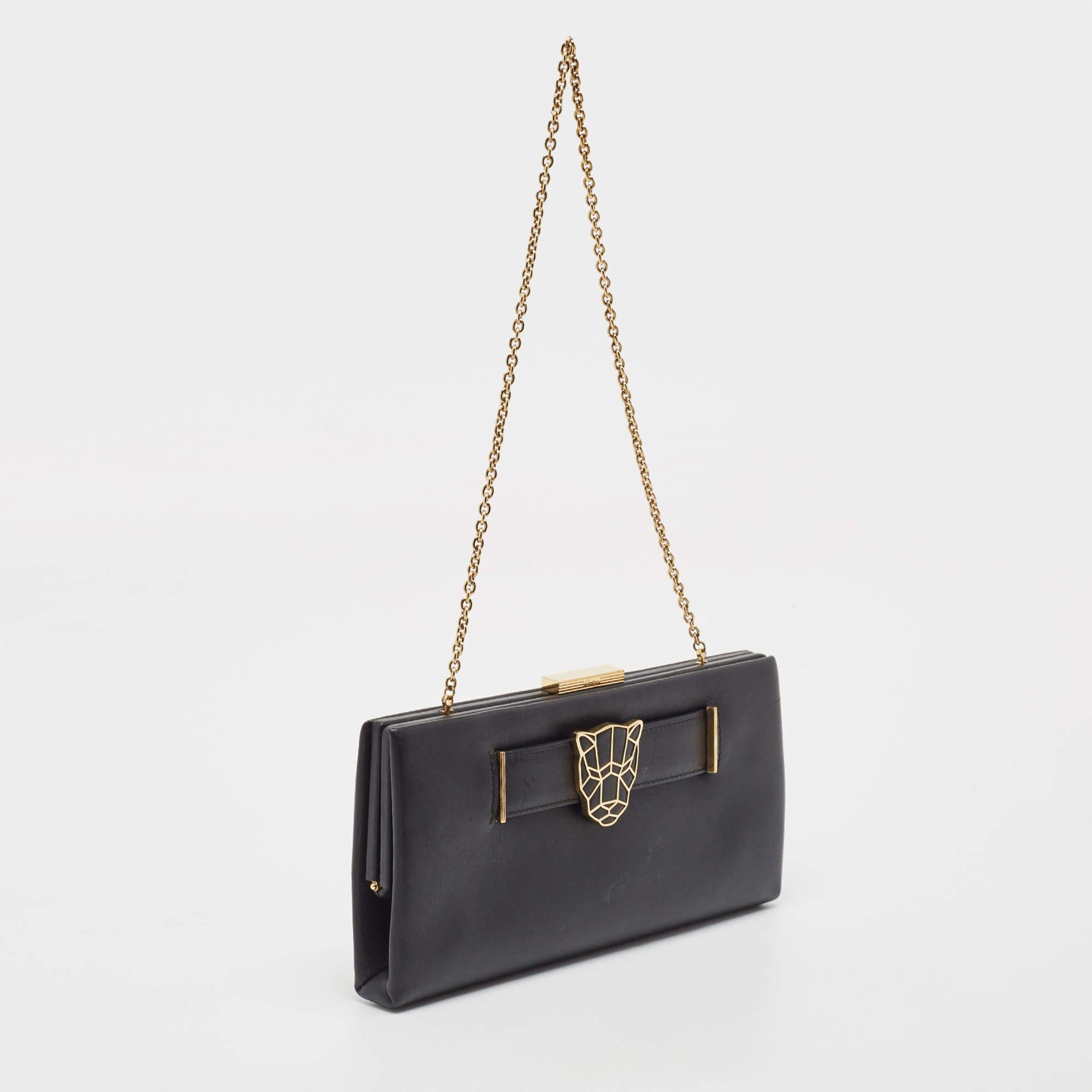 This Panthere de Cartier clutch is crafted from black leather and comes with a chain handle. The lined interior will hold your essentials and the panther detail on the front will deliver a look of luxury.

