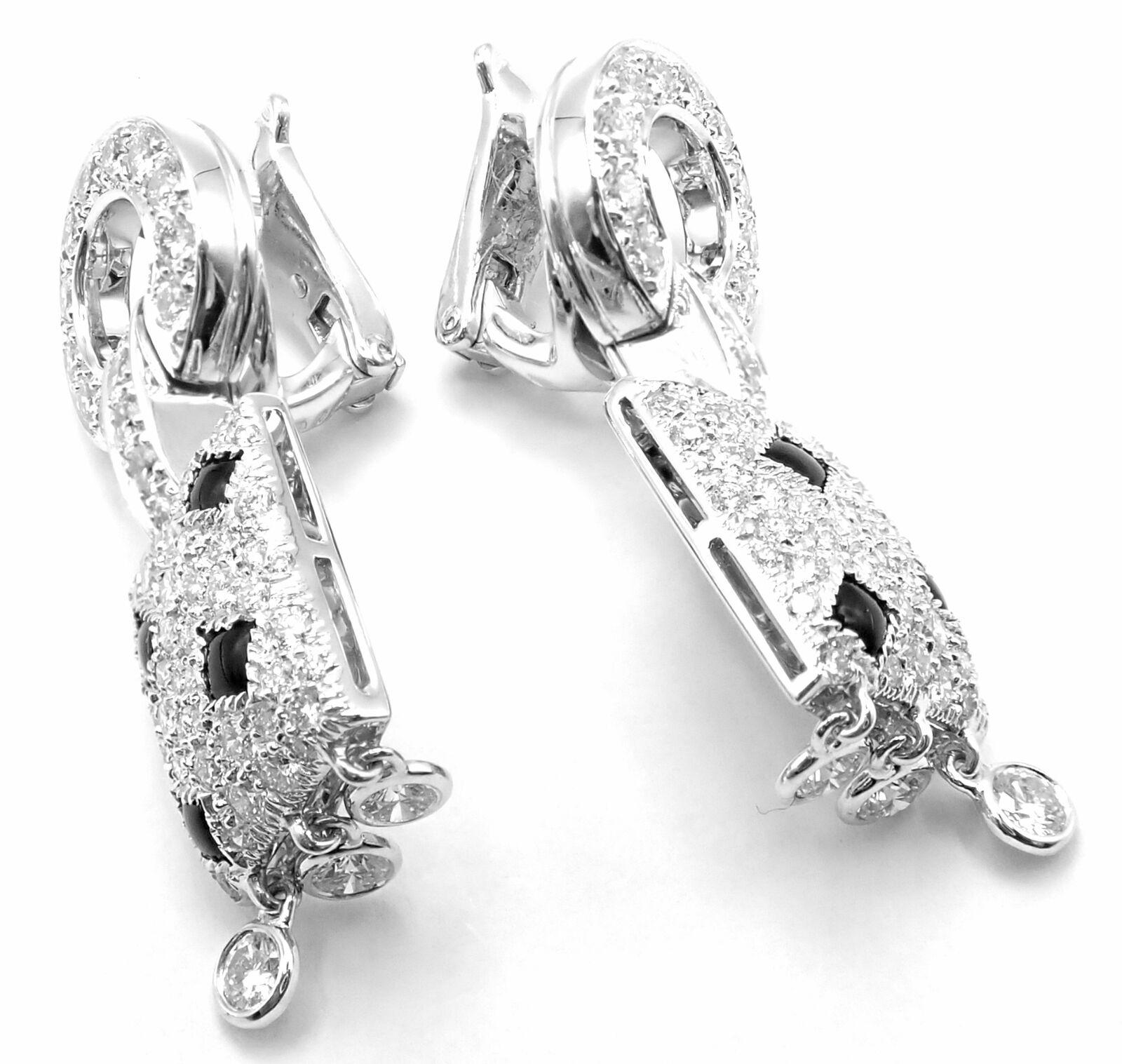 18k White Gold Panthere Diamond And Black Onyx Earrings by Cartier. 
With Round brilliant cut diamonds total weight approx .98ct.
Diamonds VVS1 clarity, E color and black onyx
These earrings come with service paper from Cartier From NYC and Cartier