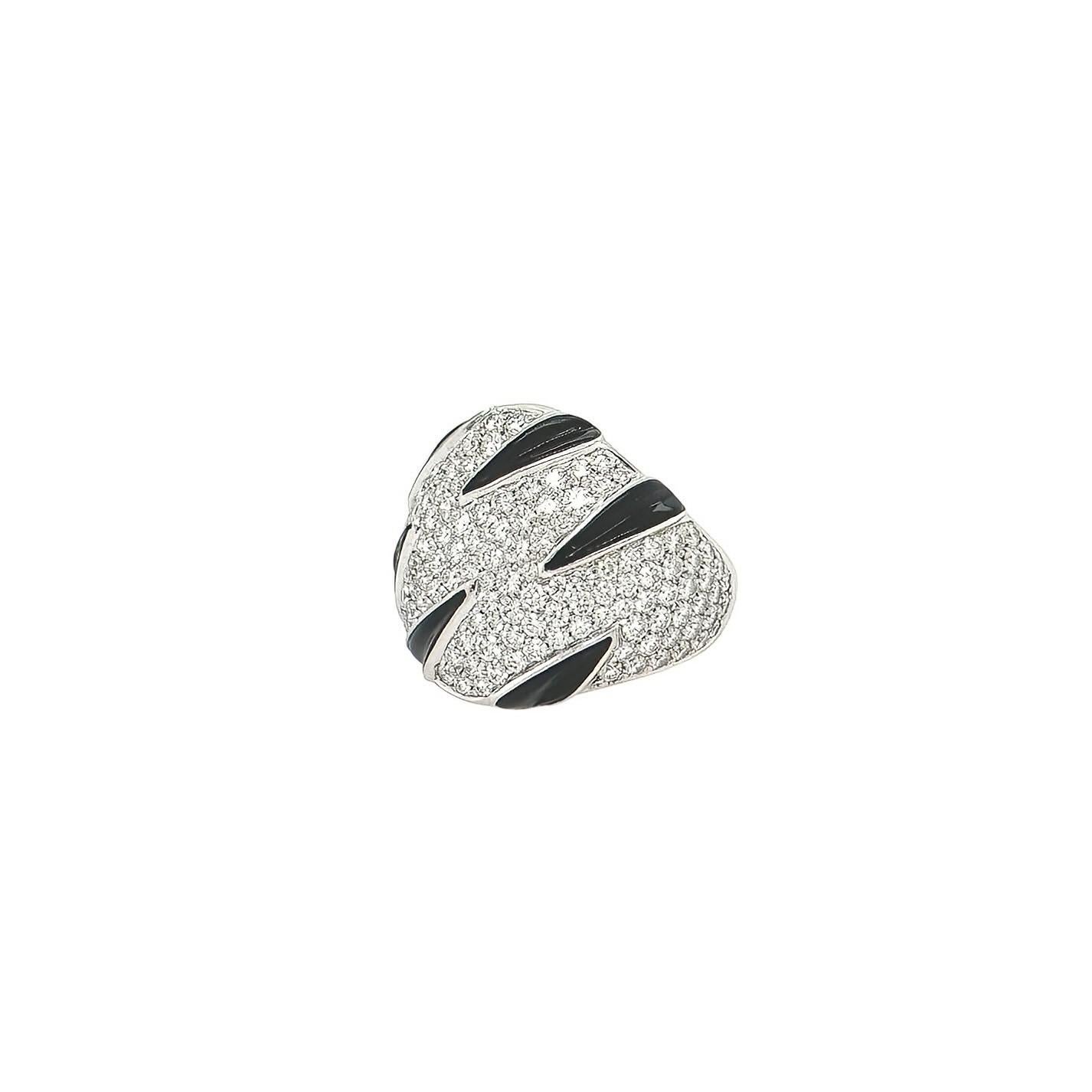 An 18 karat white gold, black onyx and diamond ring, Cartier.  Fashioned as a zebra design pave set with approximately 145 round brilliant cut diamonds with six stripes of black onyx.  Total diamond weight approximately 3.85 carats.  Size