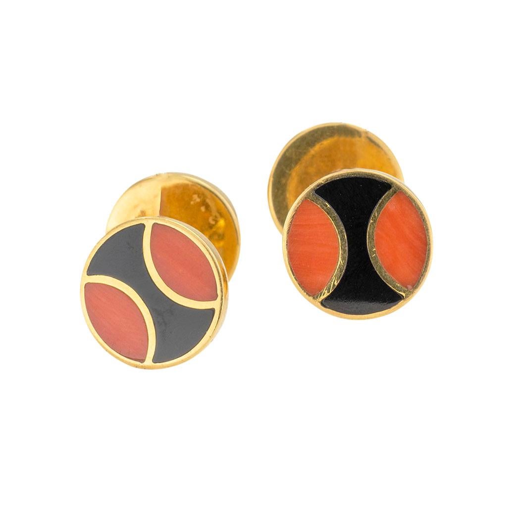 Cartier coral and black onyx yellow gold double-sided cufflinks circa 1960.  

We are here to connect you with beautiful and affordable antique and estate jewelry.

SPECIFICATIONS:

GEMSTONES:  inlaid black onyx and red coral decorations.

METAL: 