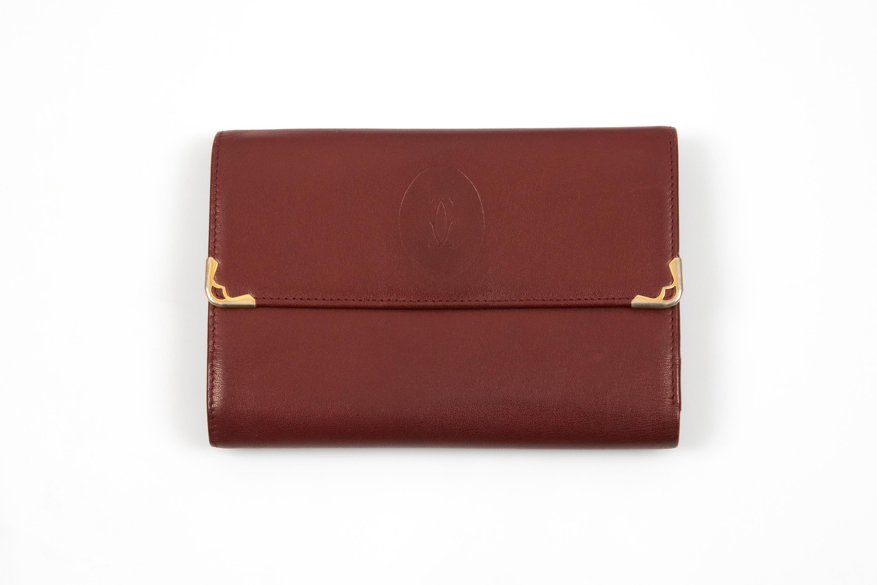 Cartera grande de piel burdeos Cartier en venta 1