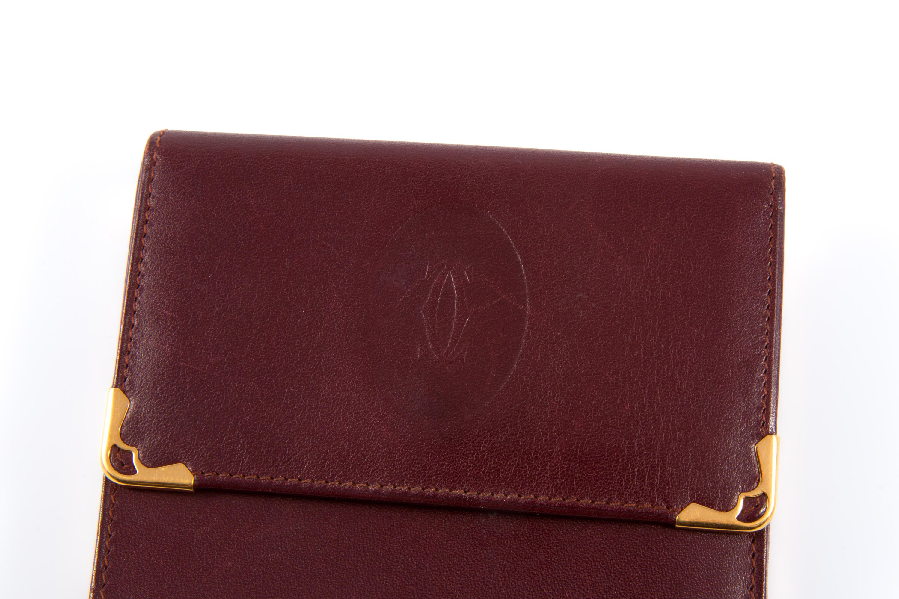 Women's or Men's Cartier Bordeaux Leather Wallet For Sale