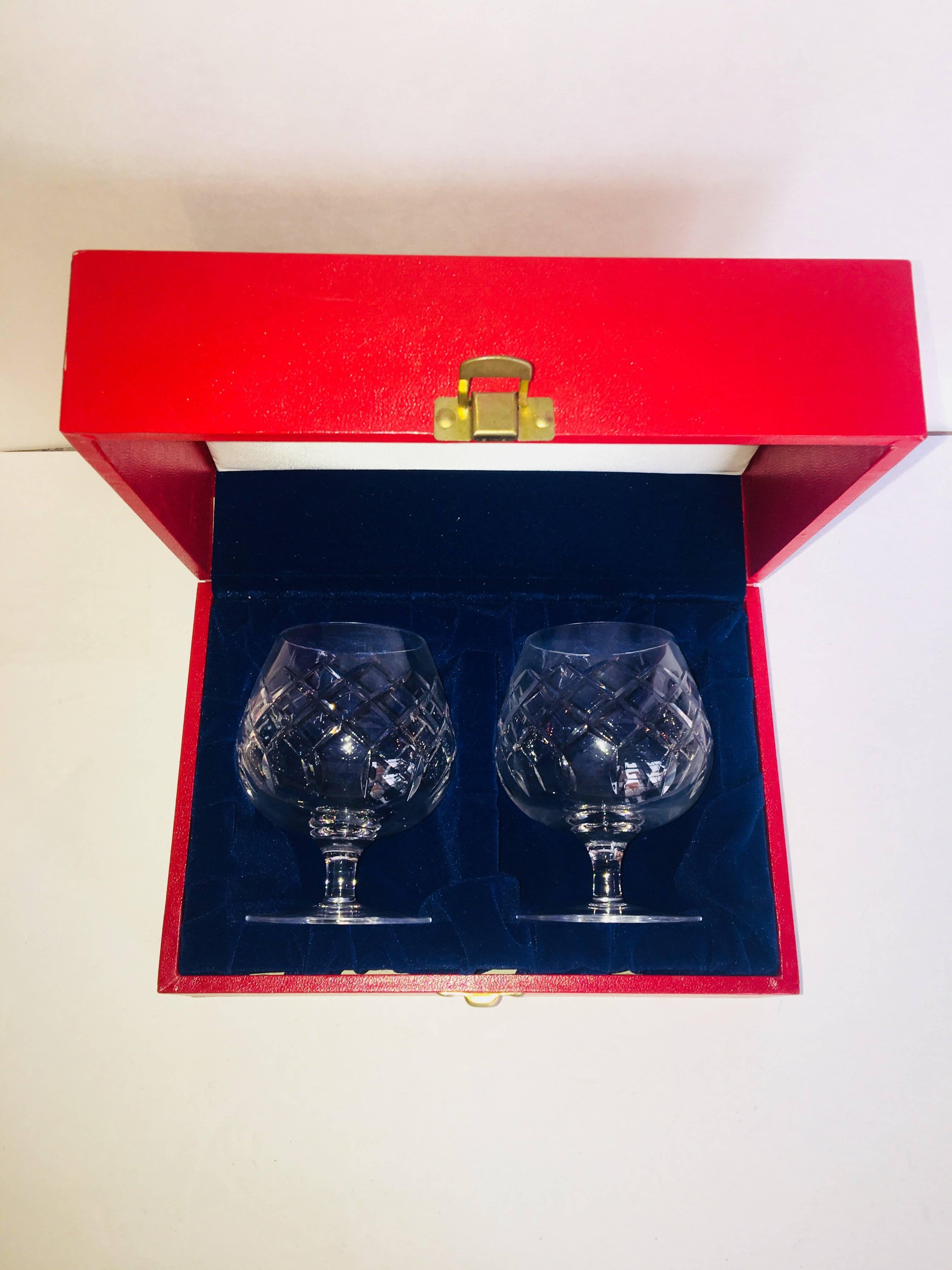 Vintage Cartier brandy snifters in original box with metal clasp and velvet interior. Pair of two etched crystal brandy snifters measuring 4.5