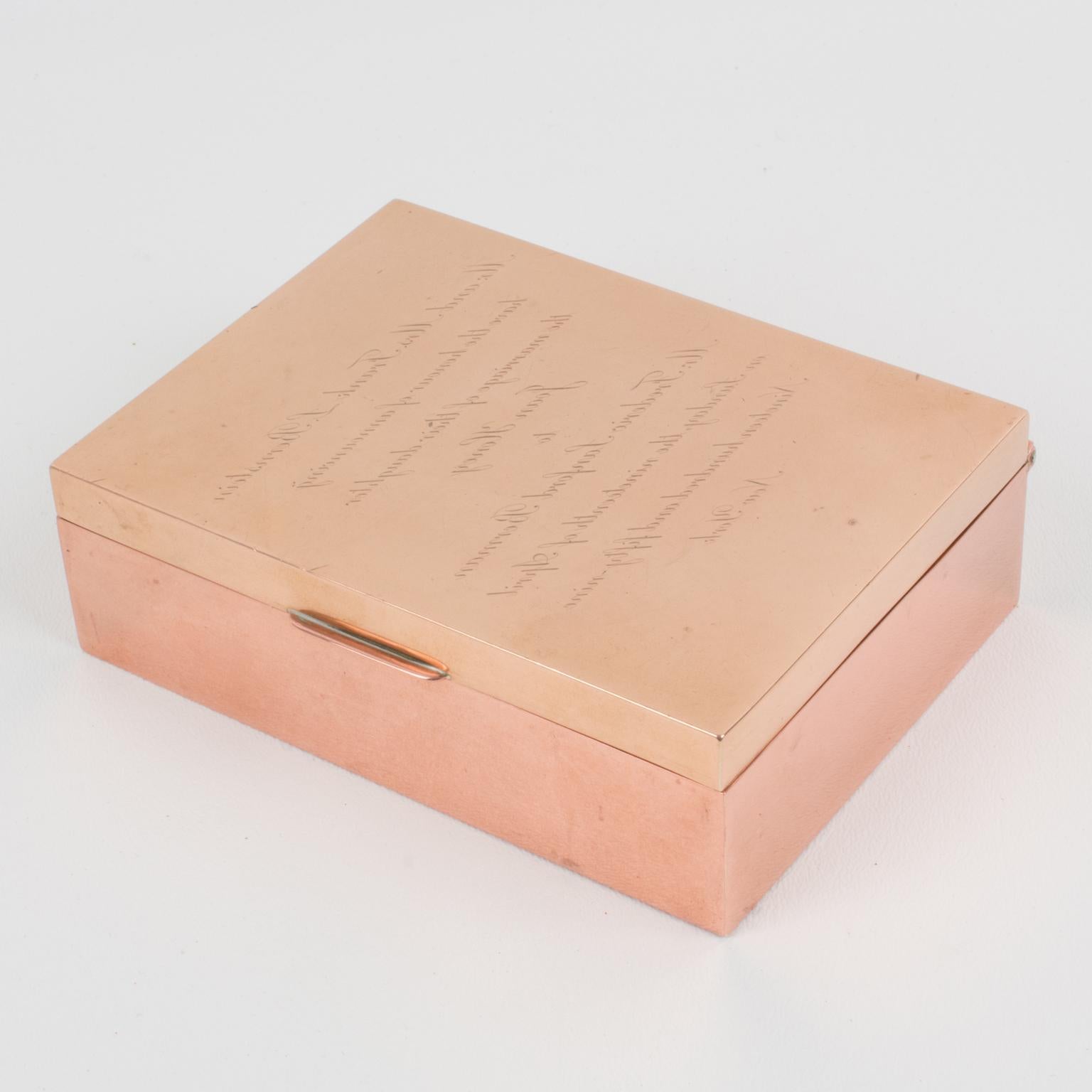 Cartier Paris crafted this sophisticated copper and brass decorative box in the 1950s. It is a puzzle box that uses Leonardo da Vinci's specular writing technique*. If you look at the box the straight way, the text engraved on the top is
