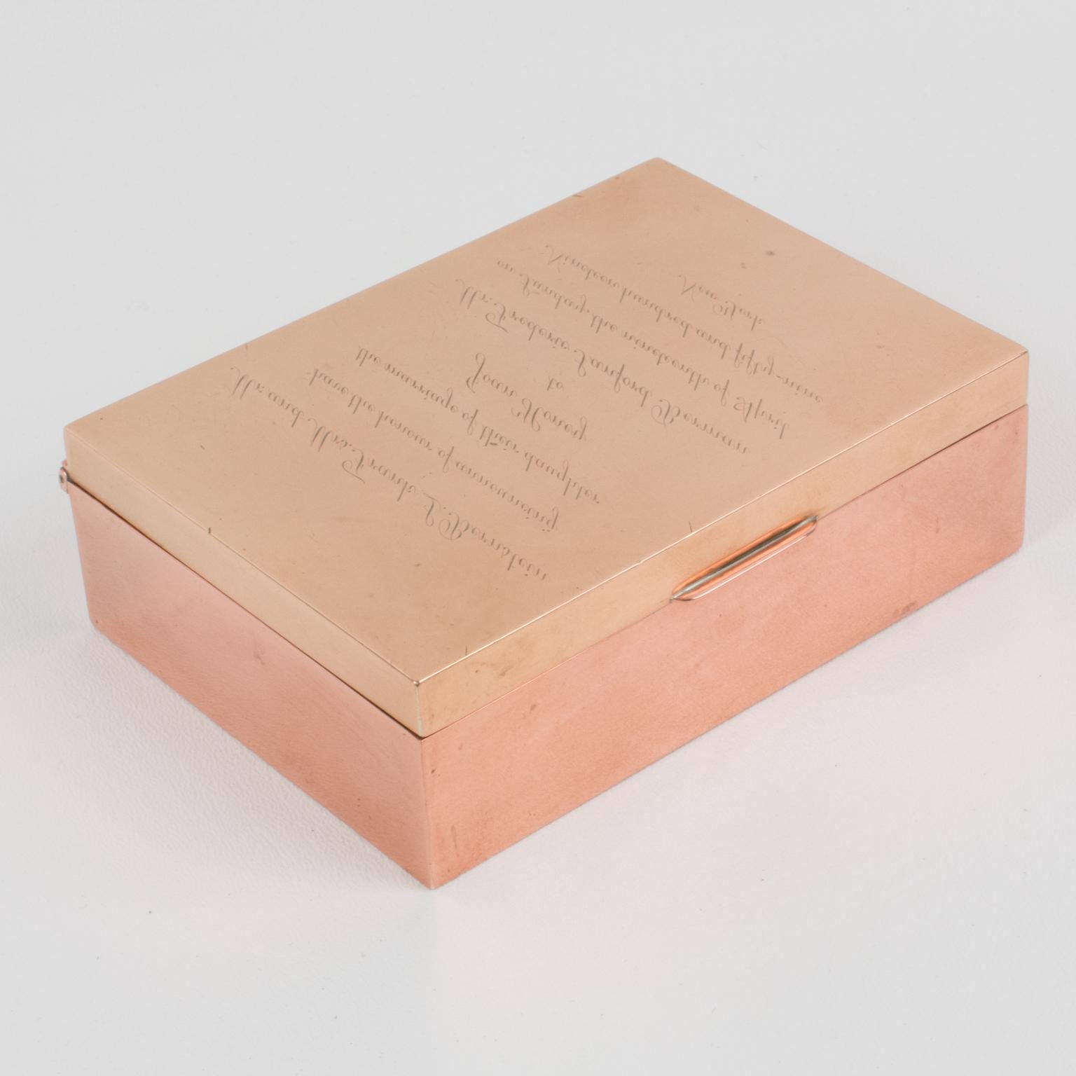 Cartier designed this stunning luxury copper and brass box. That rare piece was crafted in France circa 1950. It is an Enigma box that uses Leonardo da Vinci's specular writing technique. If you look at the box straight on, the engraved text on the