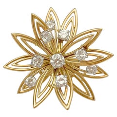 Cartier brooch, stylized flower set with diamonds.
