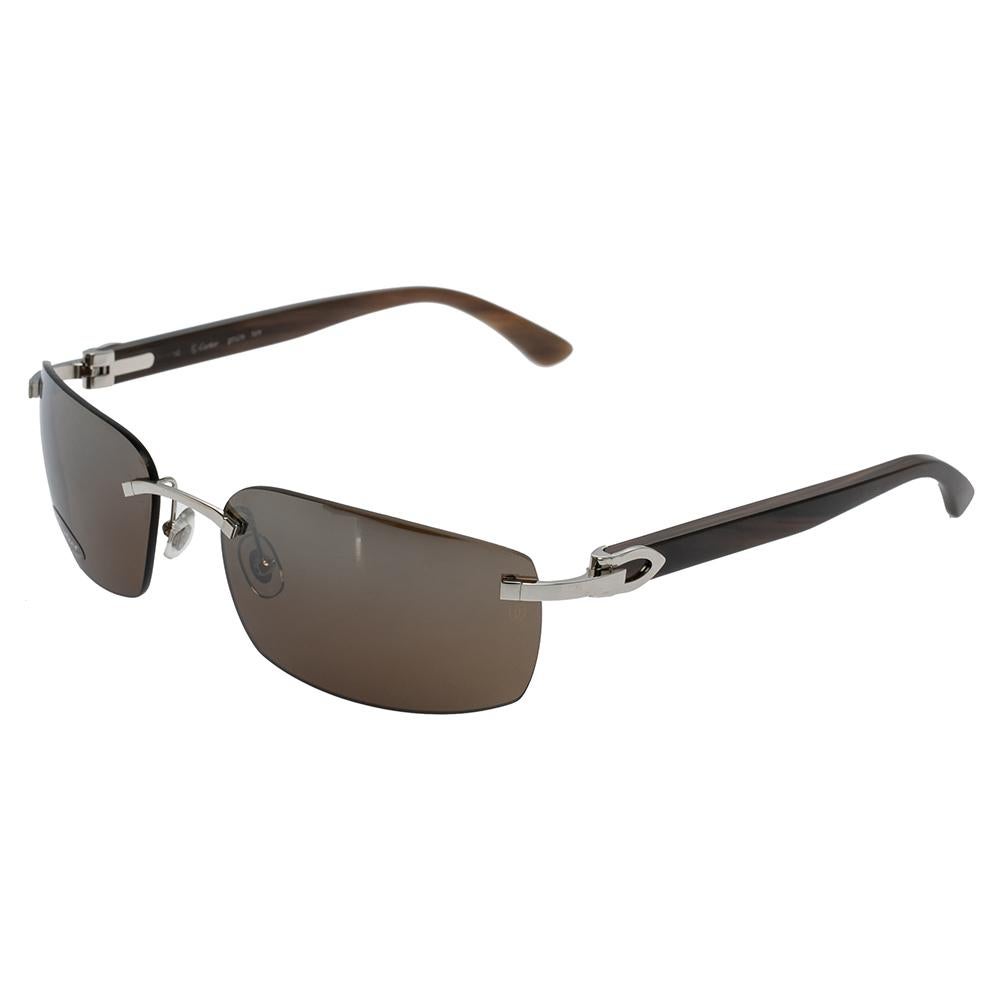 Cartier’s C Décor will make a regal addition to your collection. The pair comes with buffalo horn temples and silver-tone hardware. The classy temples go well with the brown lens. Adjustable nose pads allow a comfortable wearing
