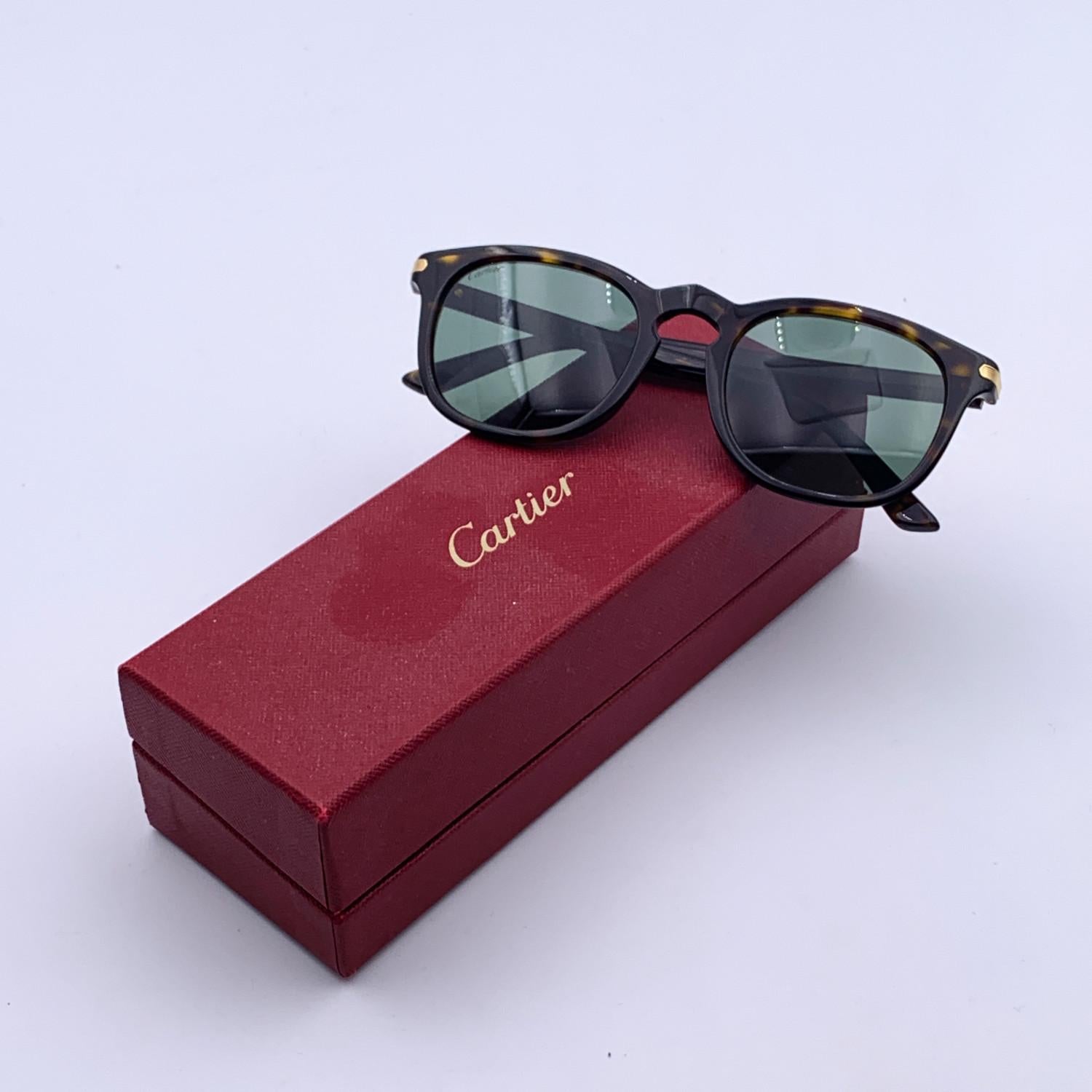 Gorgeous Cartier unisex Sunglasses. Mod. CT0011S . Full rim sunglasses with classic design. Brown acetate front with havana effect. Gold detailing on temples. Original green enses, 100% UV protection. Made in Italy.

Details

MATERIAL: