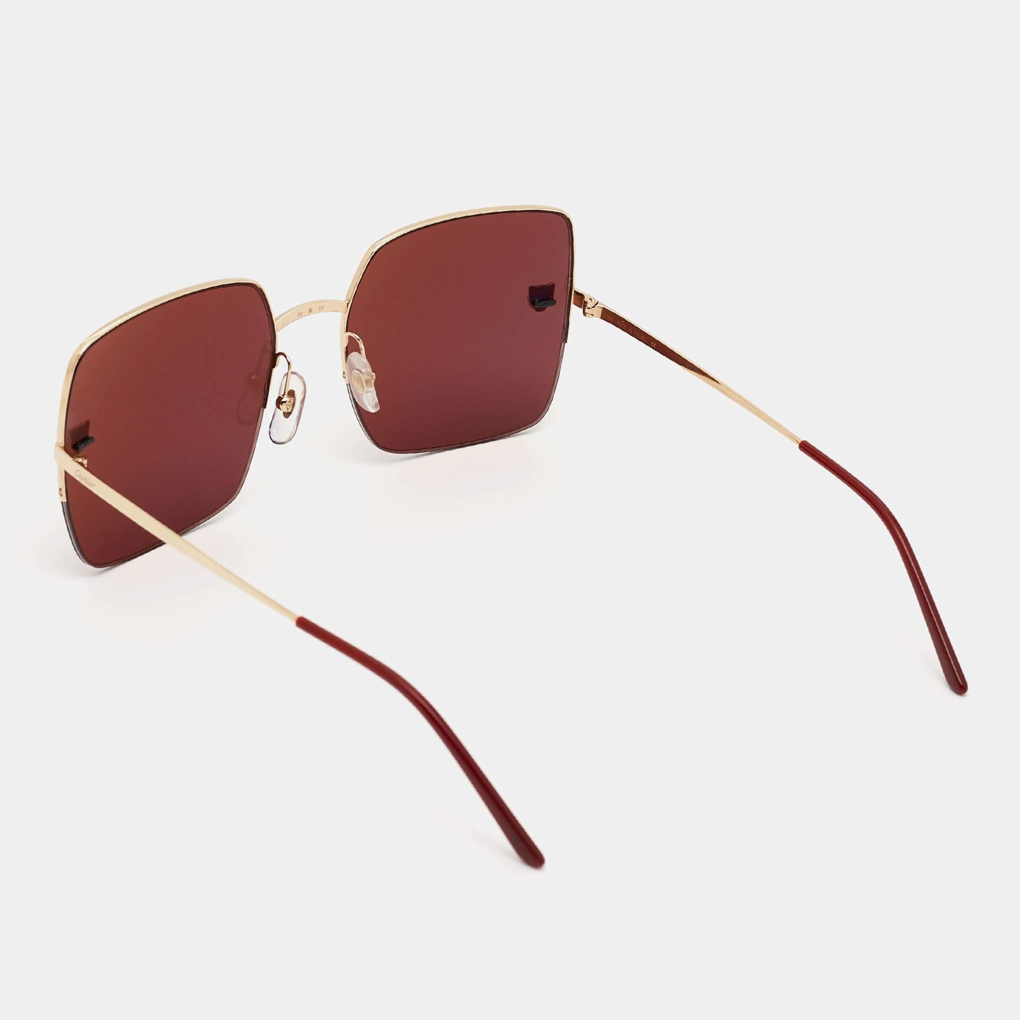 Embrace timeless allure with Cartier's Panthère de Cartier sunglasses. Crafted with precision and finesse, these sunglasses feature a striking burgundy hue, complemented by sleek square frames and iconic panther accents. Effortlessly blend style and