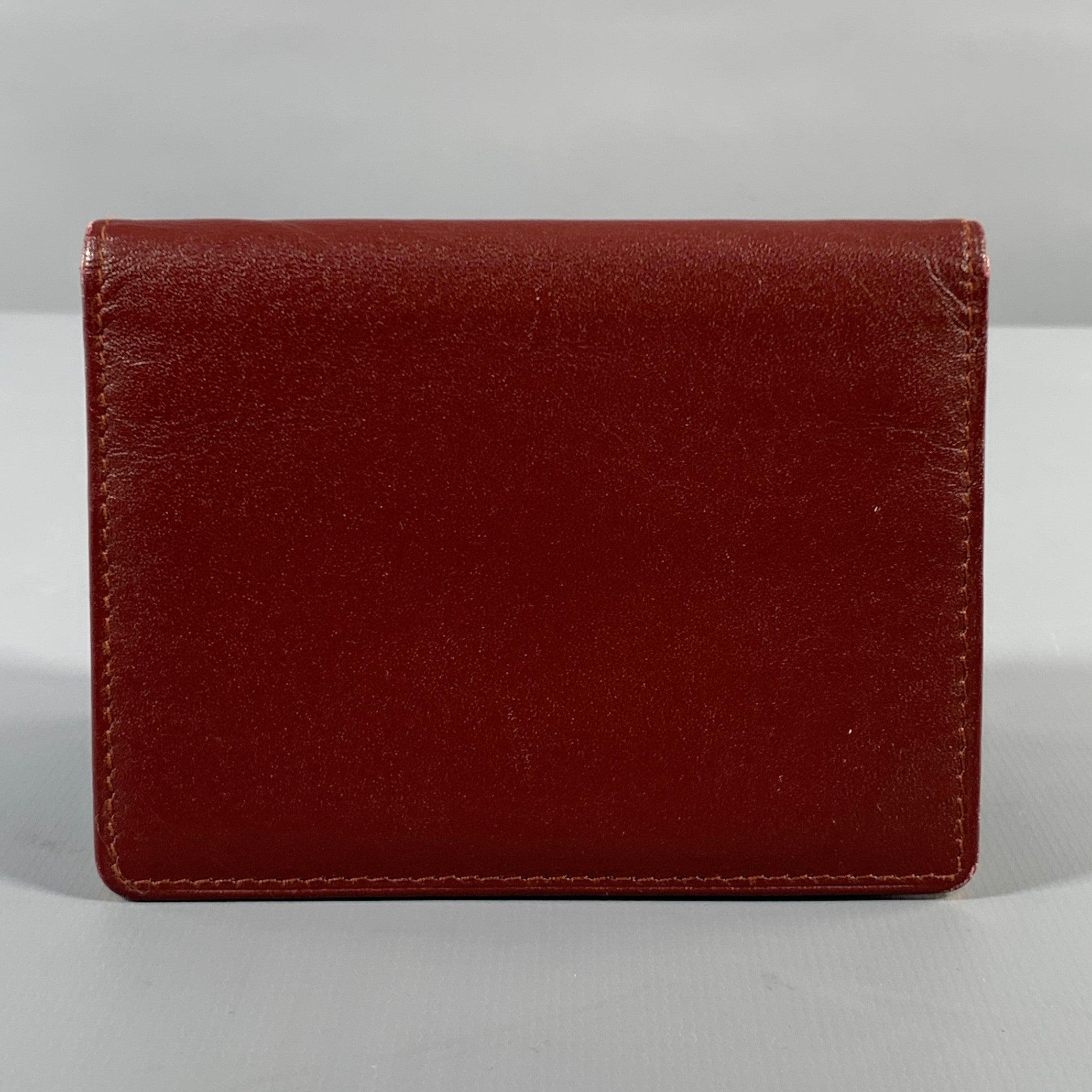 CARTIER VINTAGE card holder wallet comes in burgundy leather featuring inner slots, and bi-fold style. Includes box and card of authenticity.Good Pre-Owned Condition. Sign of wear.Card of authenticity: 29010722484.5 X 3.5 inches 
  
  
 
Sui