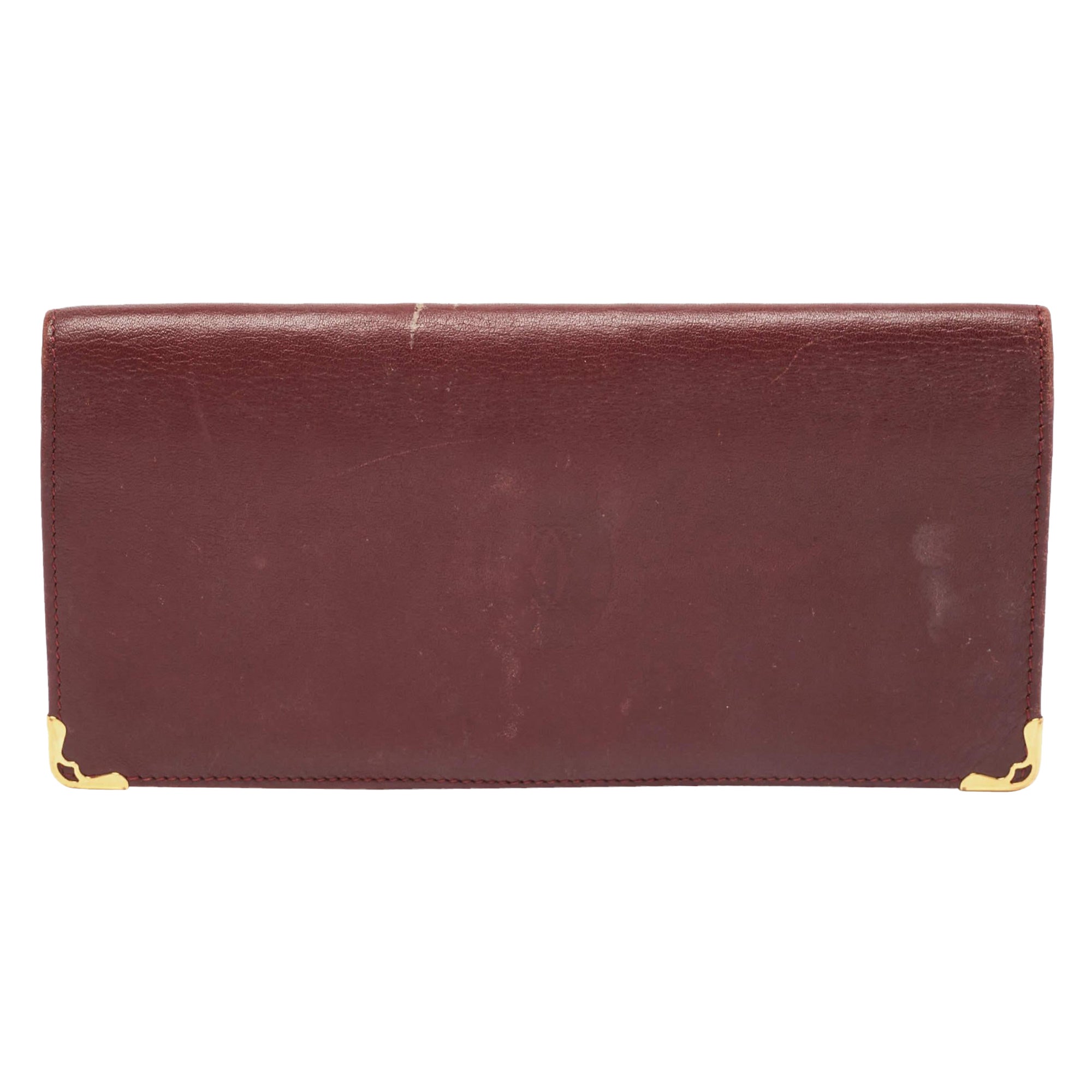 Cartier Must de Cartier Portefeuille long pliable en cuir bourgogne