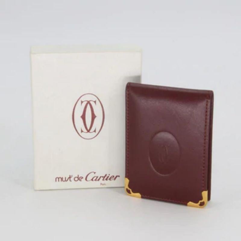 Cartier Burgundy Red Grained Double C Embossed Bifold Card Wallet CR-W0930P-0408

This Cartier Embossed Double C Logo Leather Metal Corner Notepad ID Holder is perfect for business cards or ID's. It features two window slots and an open style to aid