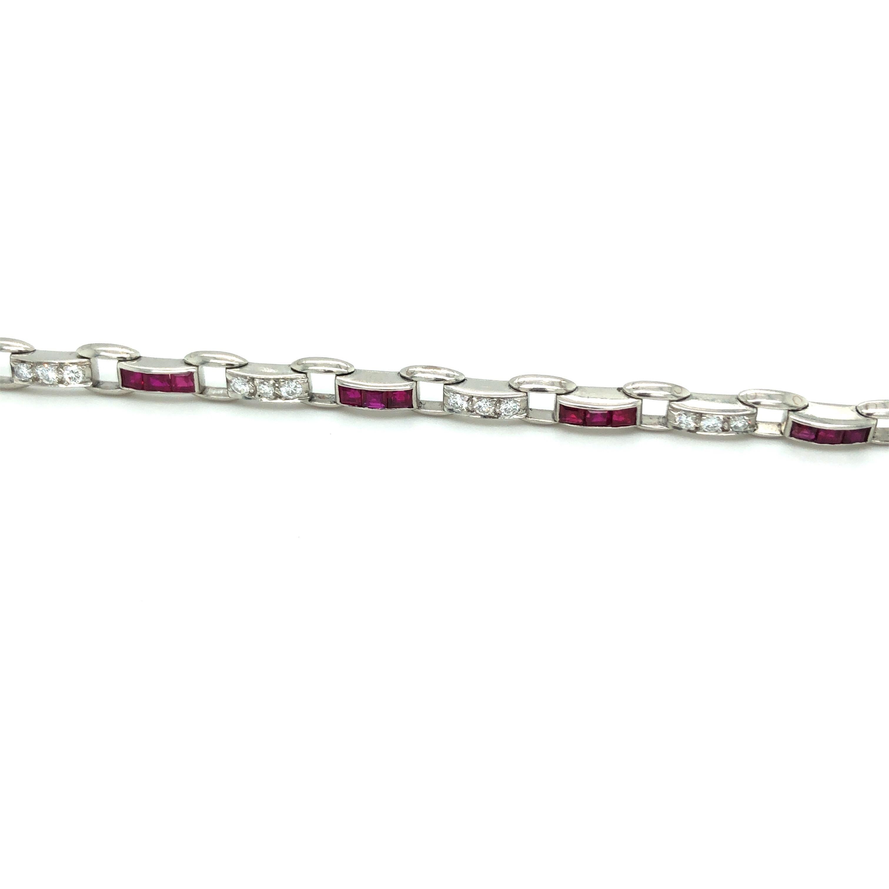 Exquisite Burma rubies and round cut diamonds platinum link bracelet by Cartier. 
Crafted in platinum and set with 24 carré-cut unheated Burma rubies totalling circa 2 carats and 24 brilliant-cut diamonds totalling circa 0.7 carats. The links are