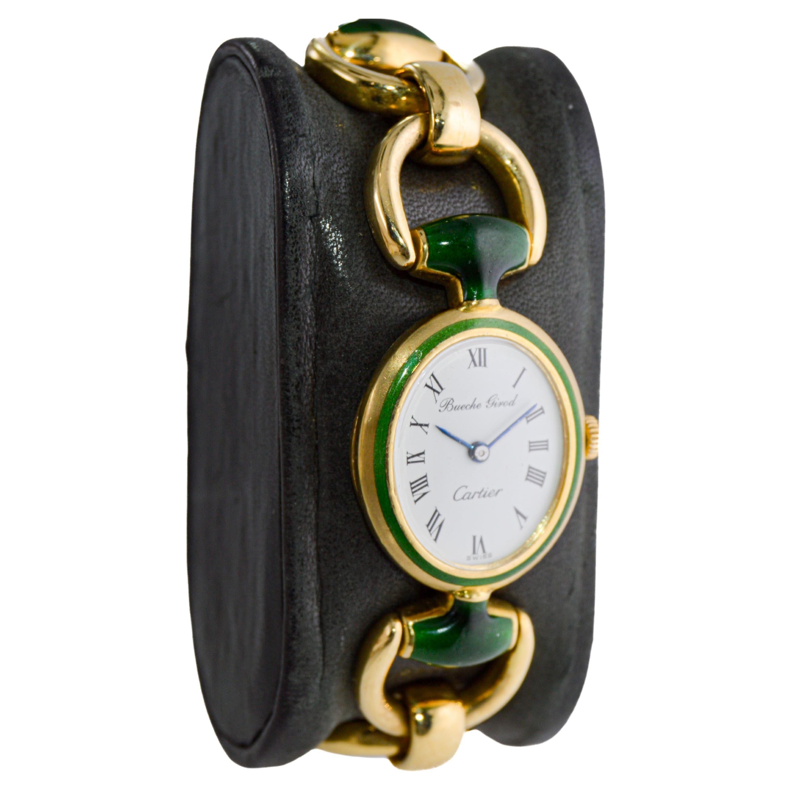 FACTORY / HOUSE: Bueche Girod for Cartier
STYLE / REFERENCE: Gold Bracelet  / Hermes Stirrup Style
METAL / MATERIAL: 18Kt. Solid Yellow Gold and Kiln Fired Enamel Links
CIRCA: 1970's
DIMENSIONS: Length 41mm X Diameter 23mm
MOVEMENT / CALIBER: Manual