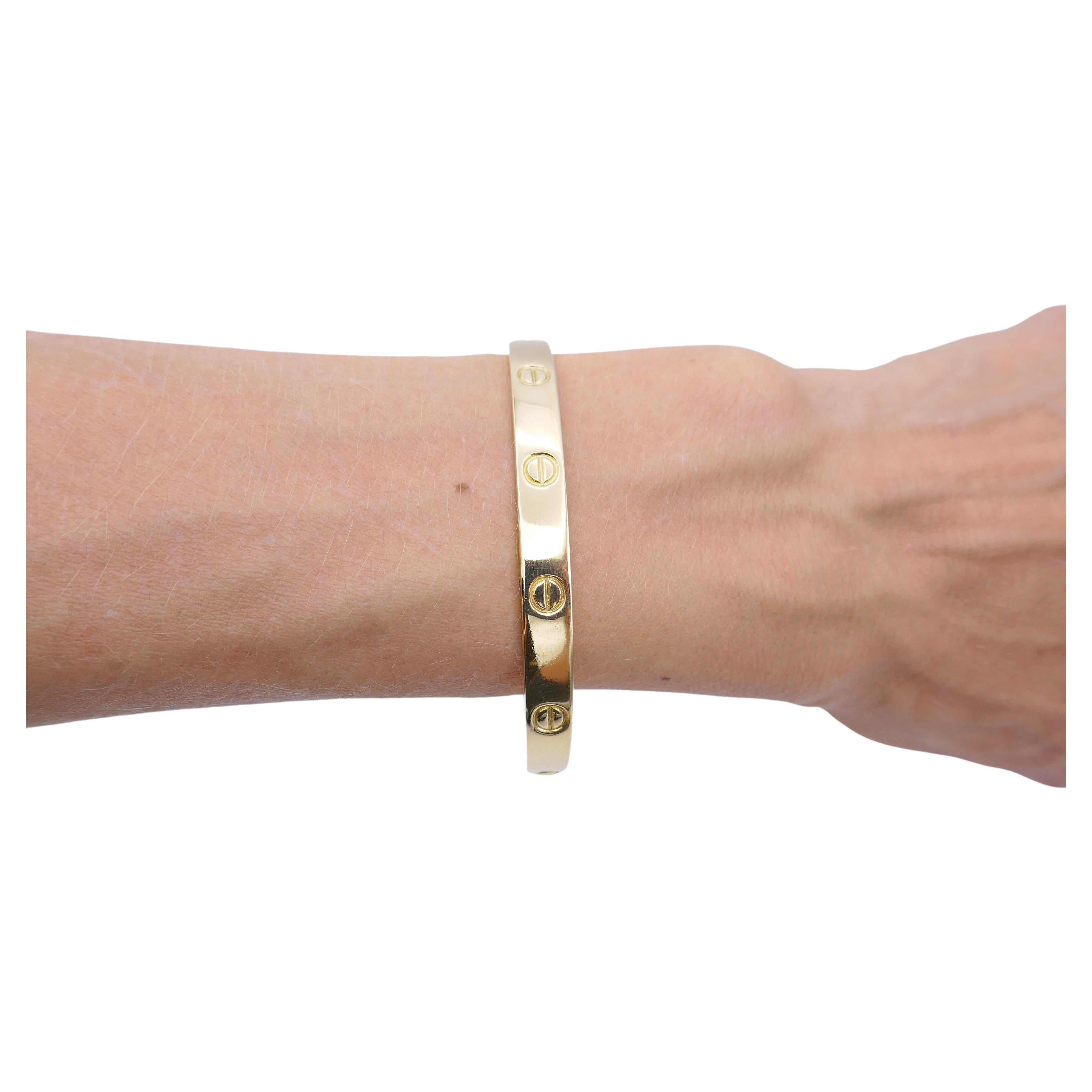 Being a symbol of commitment, a Love bracelet was designed as a minimalistic piece in 1969 and was bound to become iconic. 
The Cartier Love bracelet is supposed to be put on by someone who mutually loves you. Two screws on both sides hold the