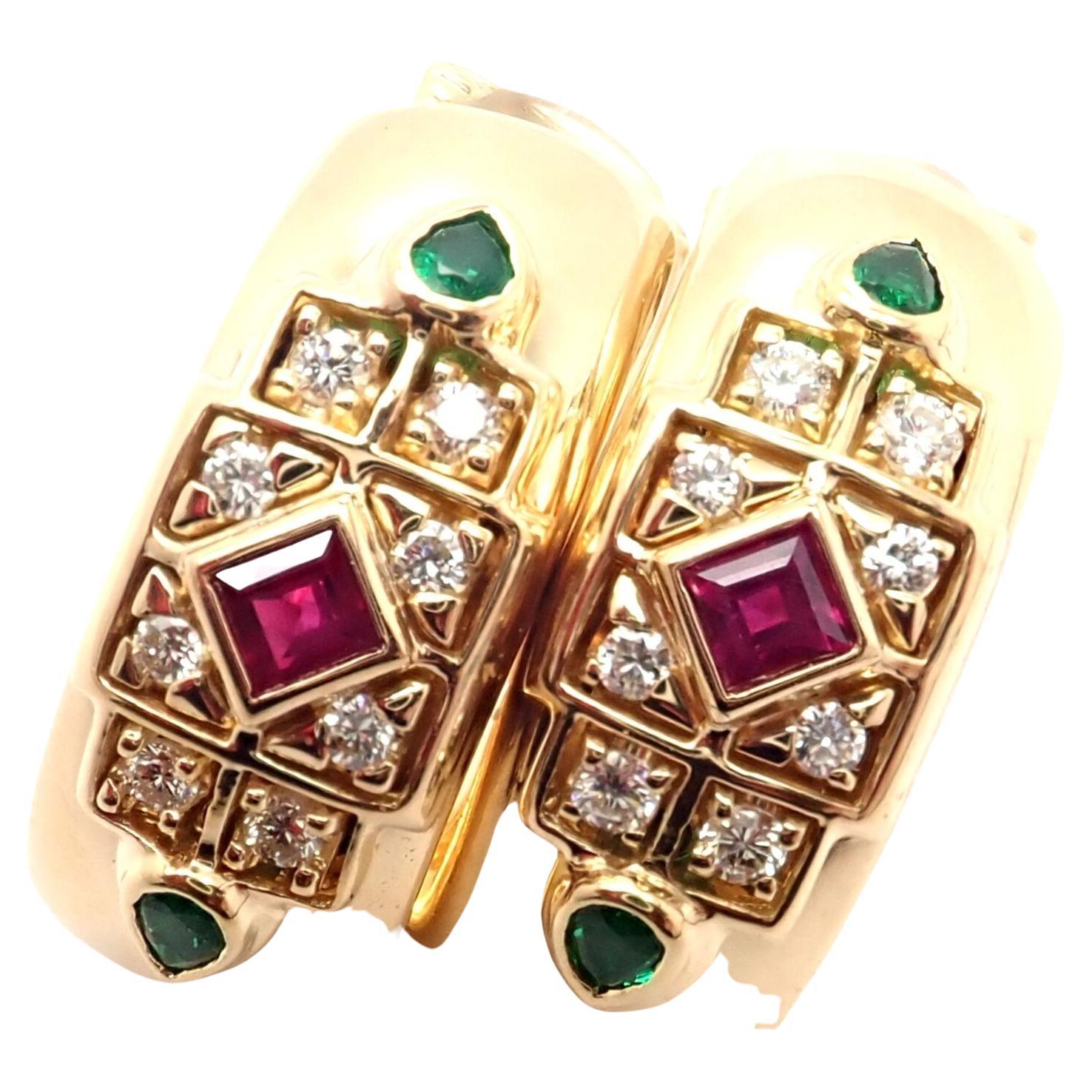 18k Yellow Gold Byzantine Diamond, Ruby, and Emerald Hoop Earrings by Cartier. 
With 16 Round brilliant cut diamonds VVS1 clarity, F-H color, 2 Rubies and 4 Emeralds
These earrings are made for non pierced ears, but they can be converted to pierced