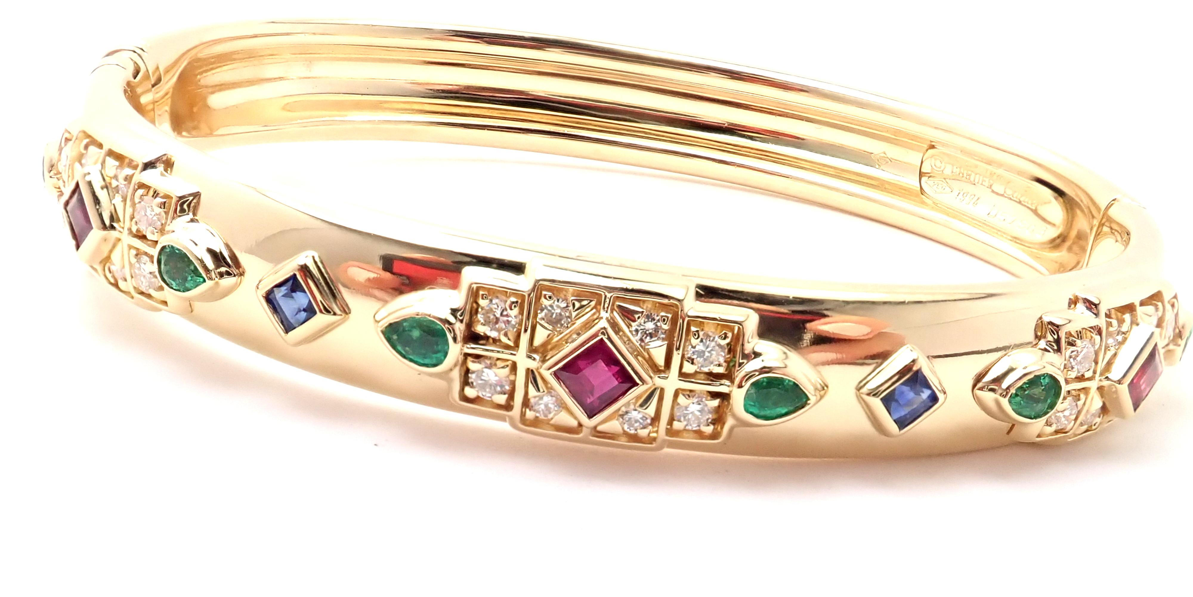 18k Yellow Gold Byzantine Diamond, Sapphire, Ruby, and Emerald Bracelet Bangle by Cartier. 
With 24 round brilliant cut diamonds VS1 clarity, E color total weigh approx. .50ct
6 emeralds total weight approx. .50ct
3 rubies total weight approx.