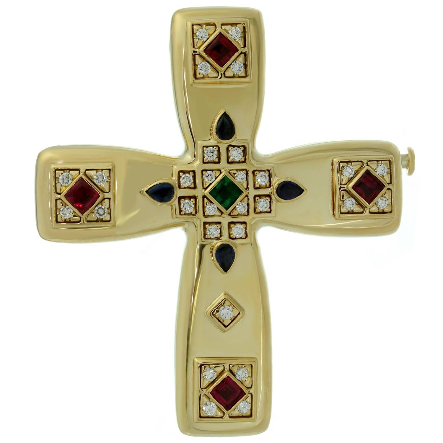 This fabulous Cartier cross is crafter in 18k yellow gold and set with diamonds, rubies, sapphires, and emerald. Can be worn as a pendant or a brooch. The Byzantine motif was designed by Louis Cartier during his trip to Russia in the early part of