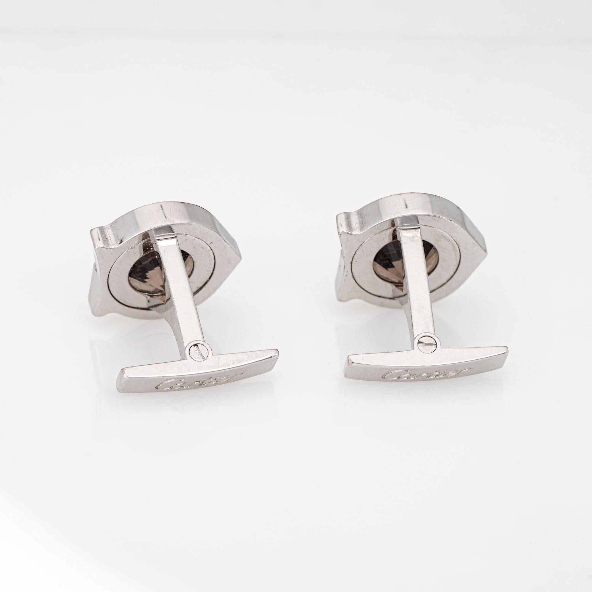 Estate Cartier smoky quartz cufflinks crafted in sterling silver, palladium finish.  

The stylish cufflinks are set with 11mm faceted smoky quartz into the Cartier 