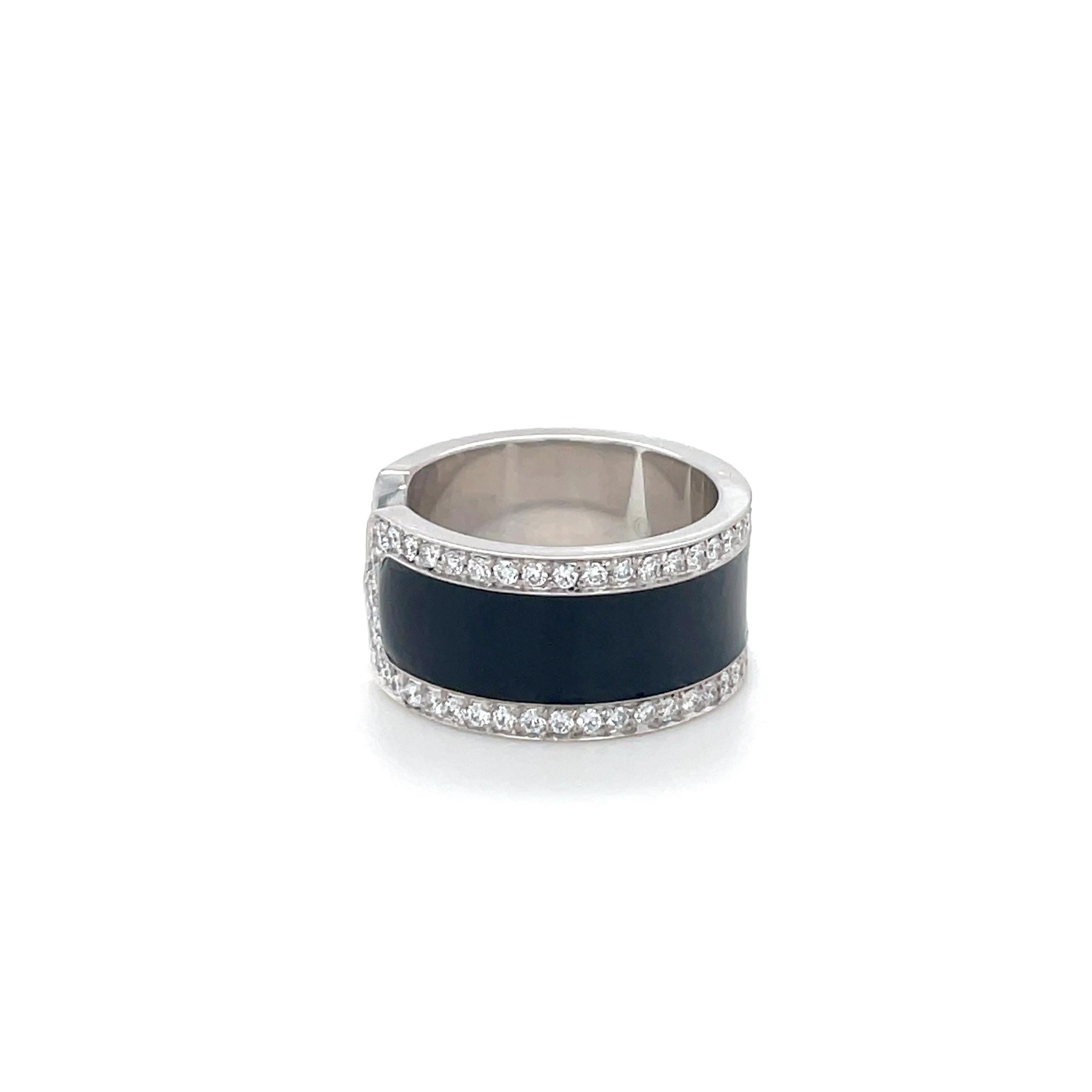 In a double C design, this classic Cartier ring contains 80 top quality round brilliant cut diamonds weighing approximately 1.50 carats total with a black enameled center. 

Ring size 6 (52)
Stamp: C Cartier 0J4368 750 52 (French maker's