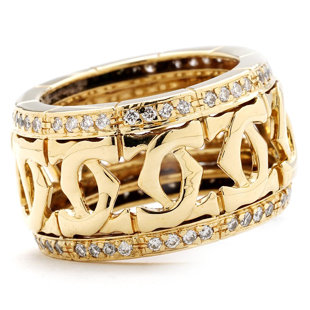 The ring is a size 6.25 (US), 12.7 mm wide, made of 18K yellow gold, and weighs 8.90 DWT (approx. 13.84 grams). It also has 80 round G-color, VS-clarity diamonds weighing 1.00 CTTW.
