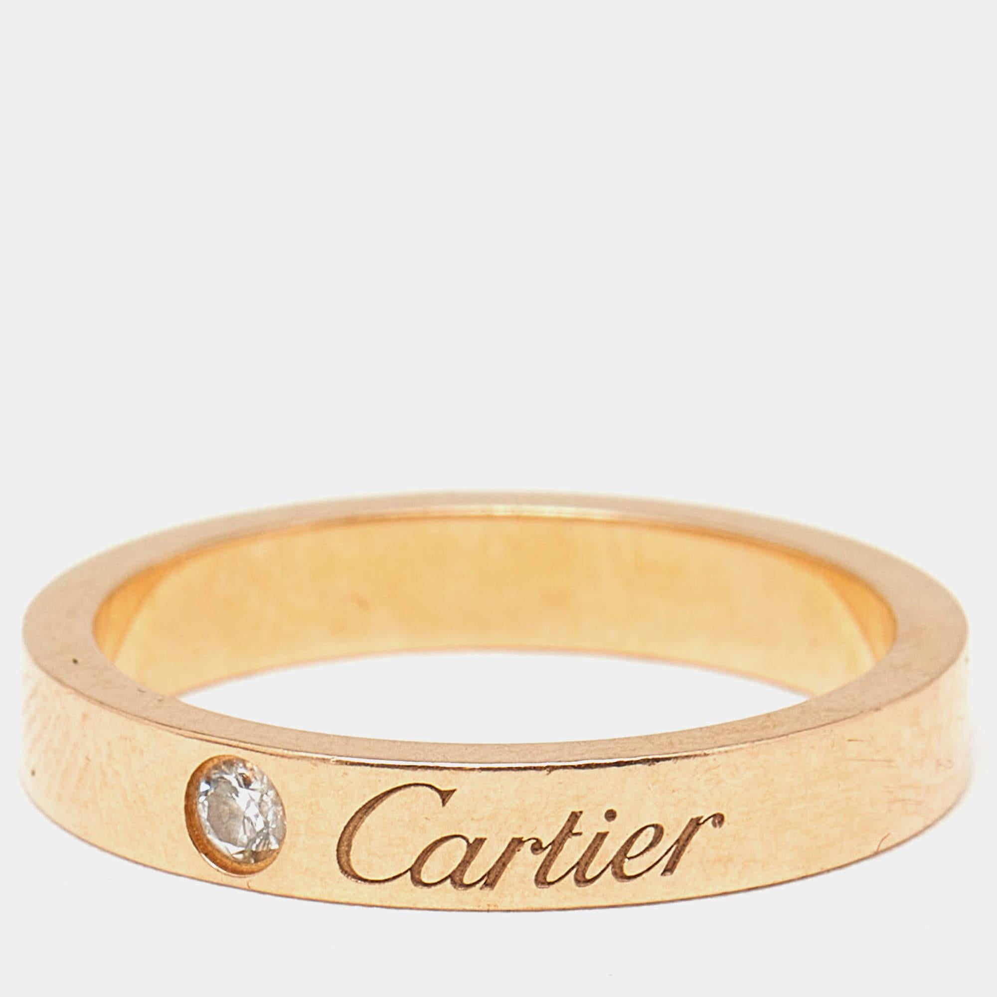 Let this C de Cartier band ring be a favored choice when it comes to choosing a ring for daily wear. The ring is made from 18k rose gold and is highlighted by brand engravings and a single diamond. It will be a prized accessory you will love wearing